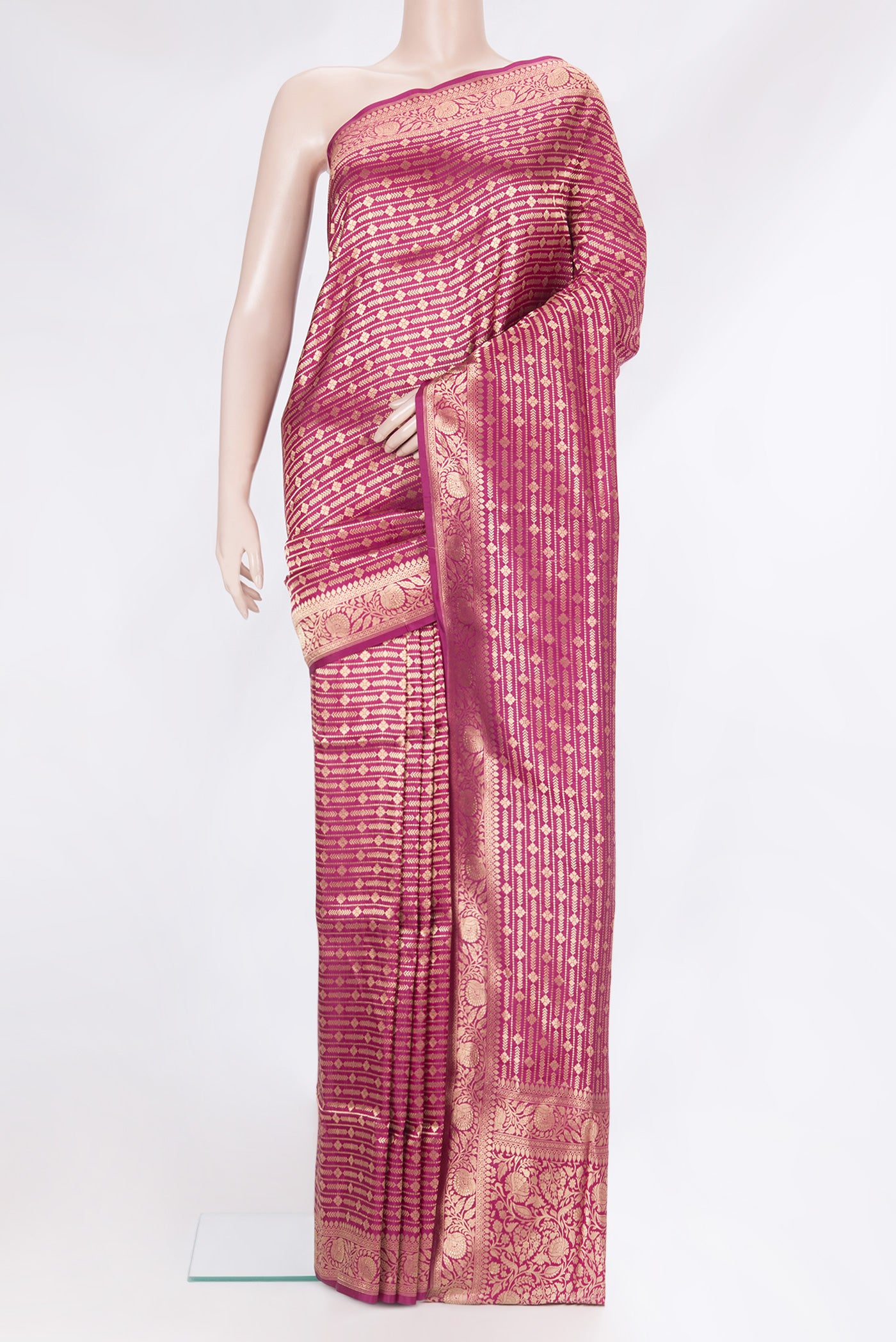 Magenta Banarasi Silk Saree with Zari Brocade on the body and Zari Border.  displayed on a mannequin