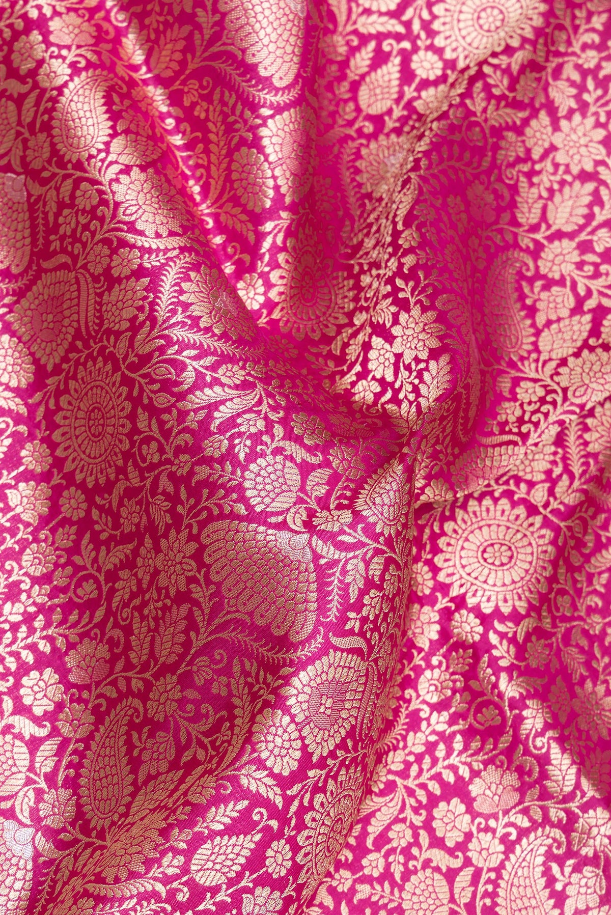 Close up of Pink Banarasi Silk Saree with Zari Brocade on the body and Zari Border.  displaying folds