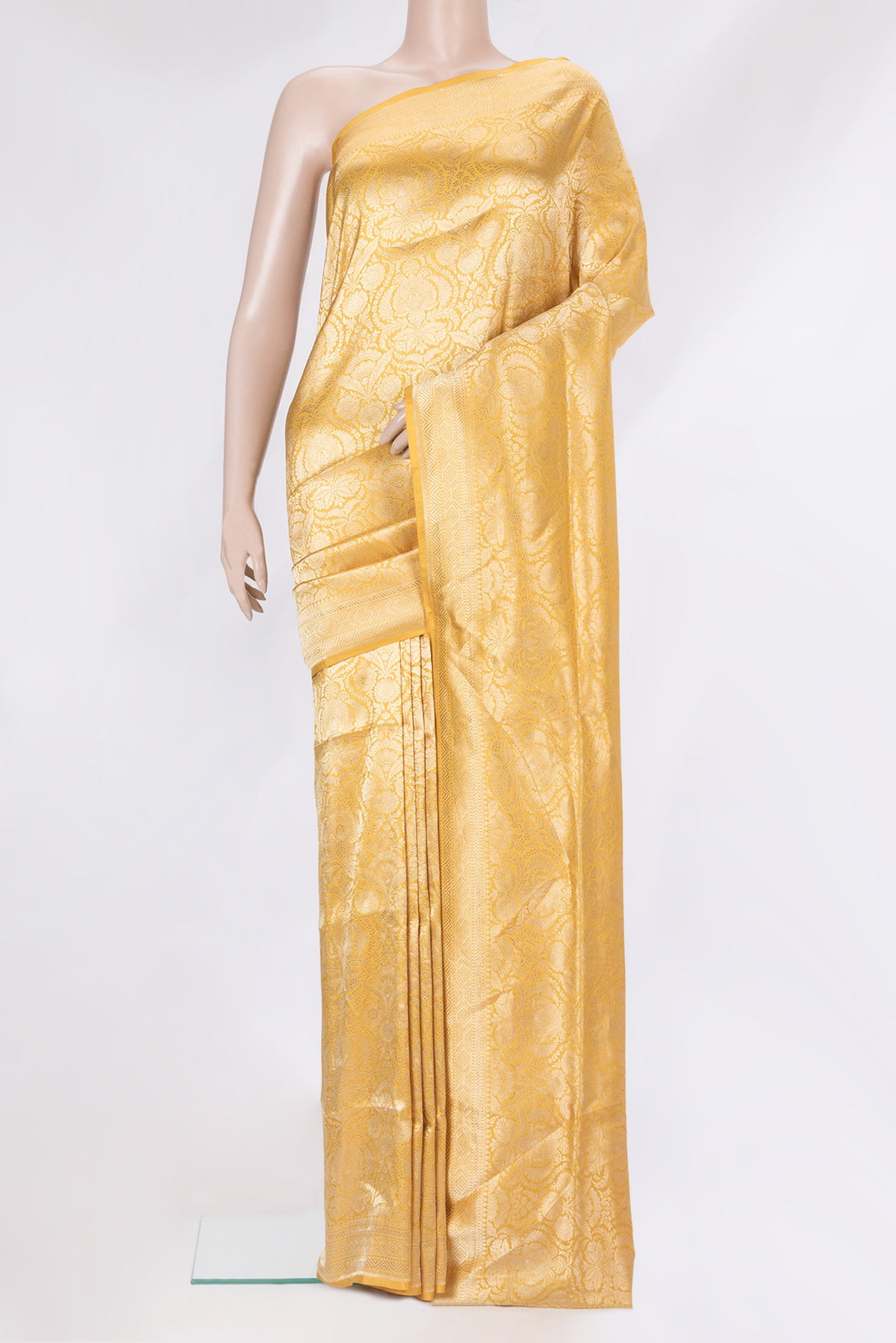 Yellow Dual Tone Banarasi Silk Saree with Zari Brocade on the body and Zari Border.  displayed on a mannequin