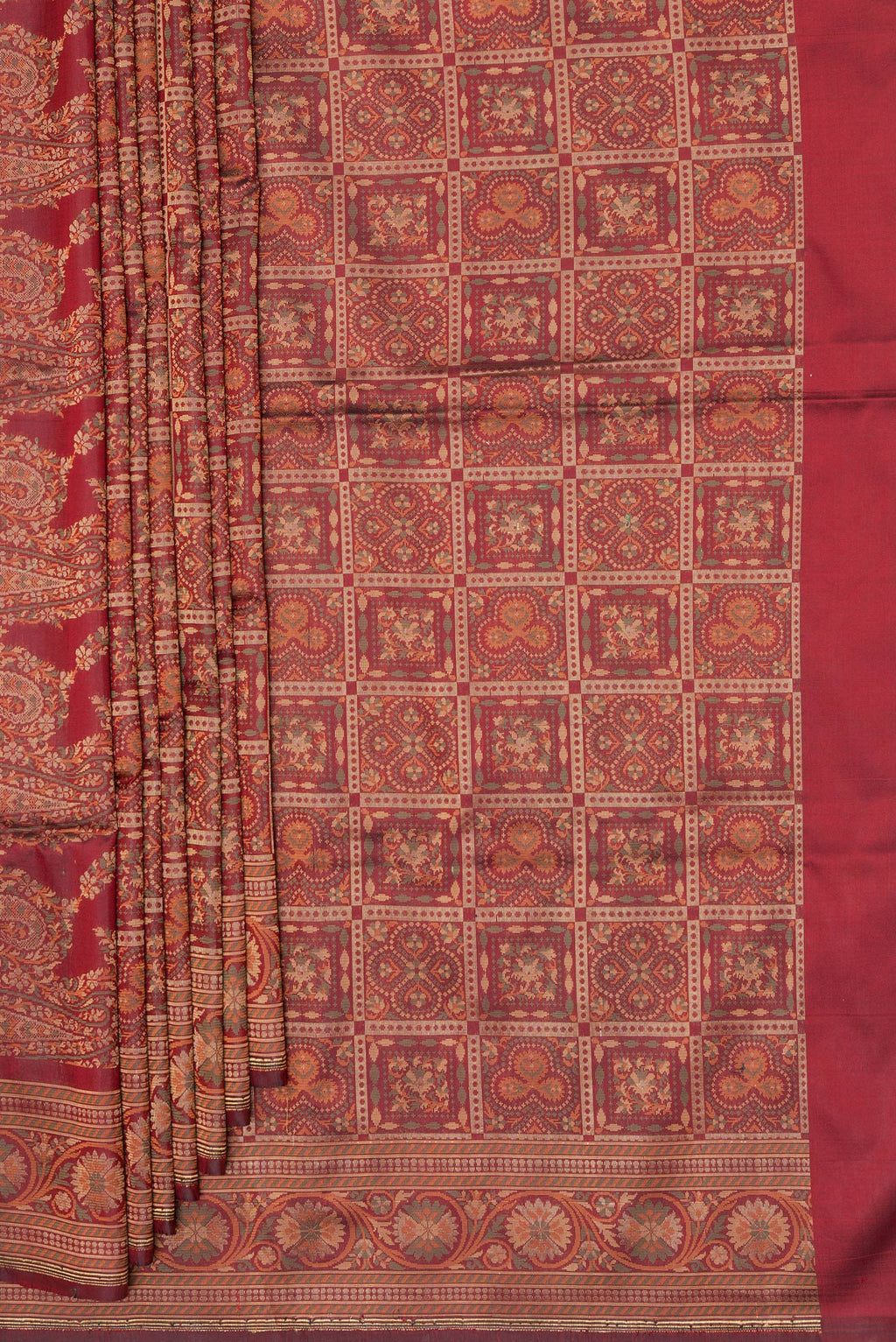 Pleats and pallu of Maroon Banarasi Silk Saree with Checked design on the body and Zari And Thread Border. 