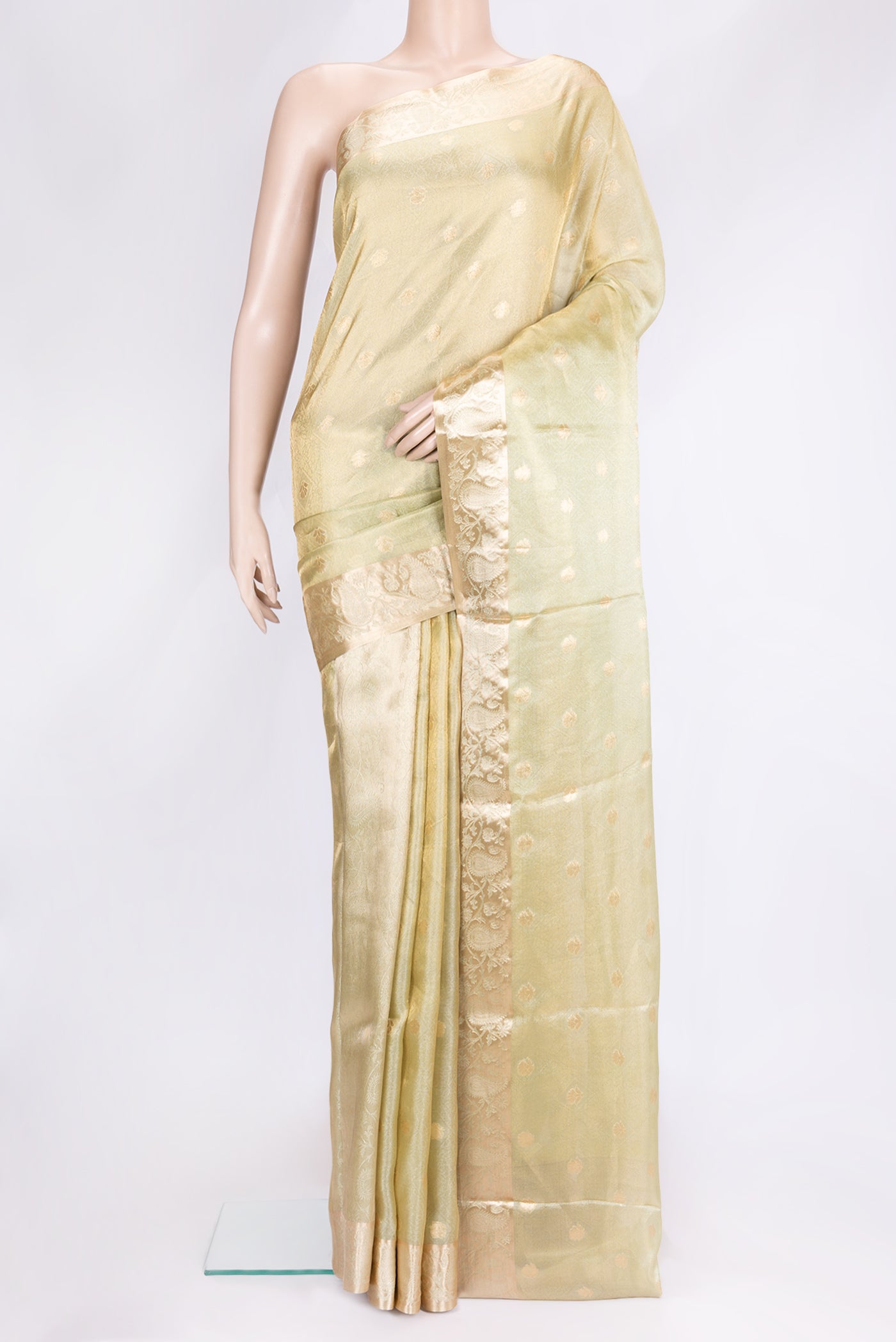 Pista Green Dual Tone Organza Silk Saree with Zari Brocade on the body and Zari Border.  displayed on a mannequin