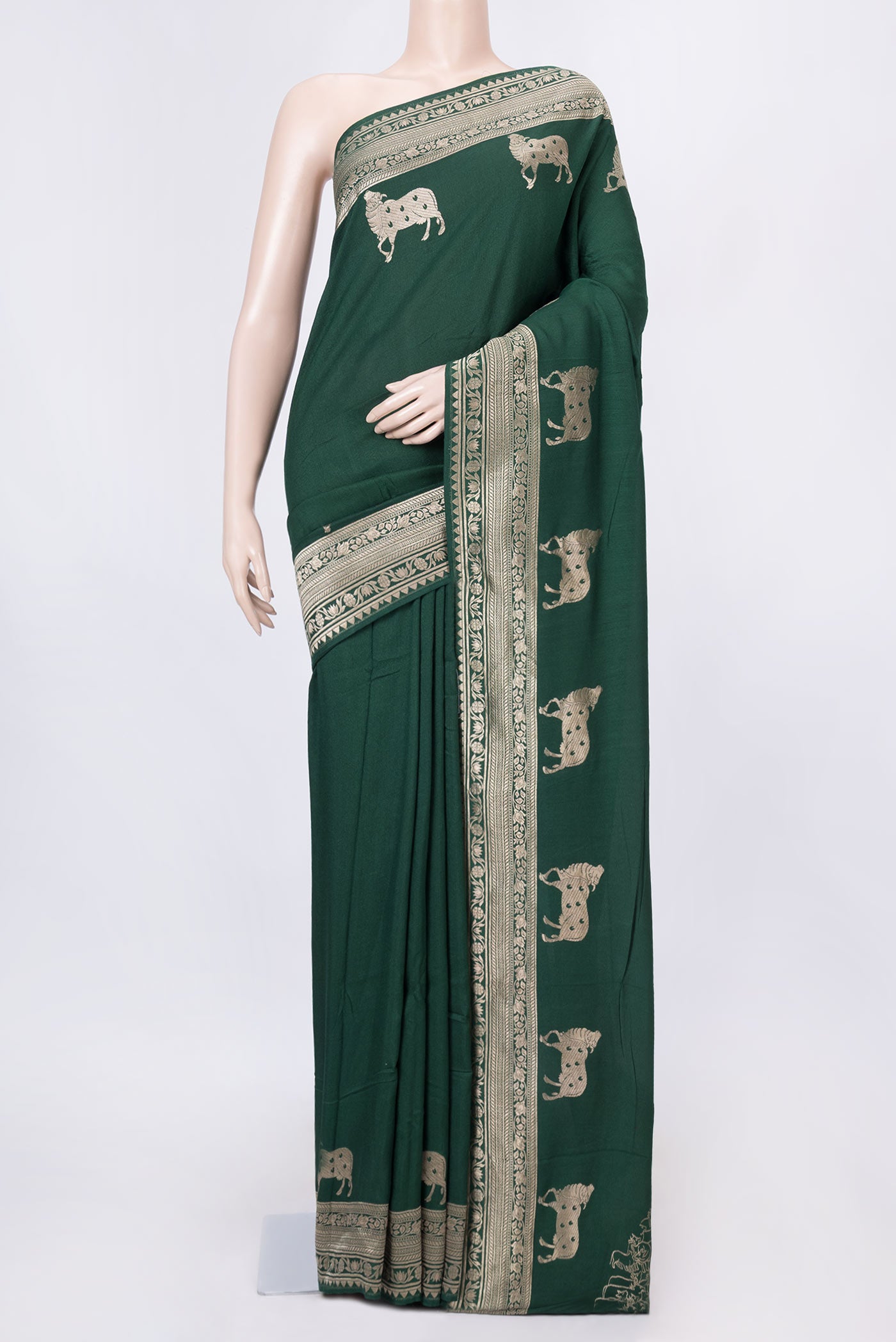 Green Dual Tone Tussar Silk Saree with Zari Butta on the body and Zari Border displayed on a mannequin