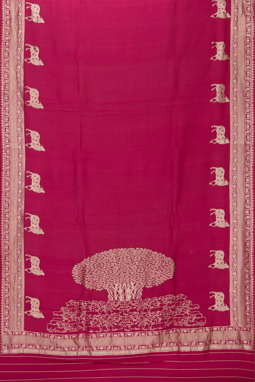 Flat view of Magenta Tussar Silk Saree with Zari Butta on the body and Fancy Border. 