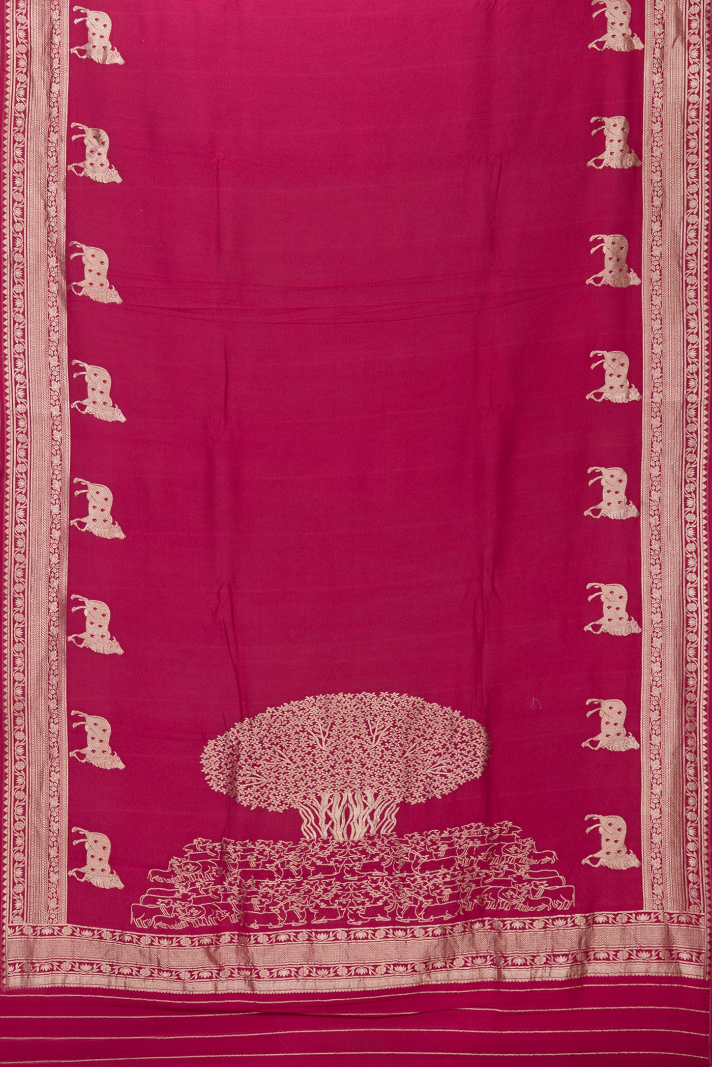 Flat view of Magenta Tussar Silk Saree with Zari Butta on the body and Fancy Border. 