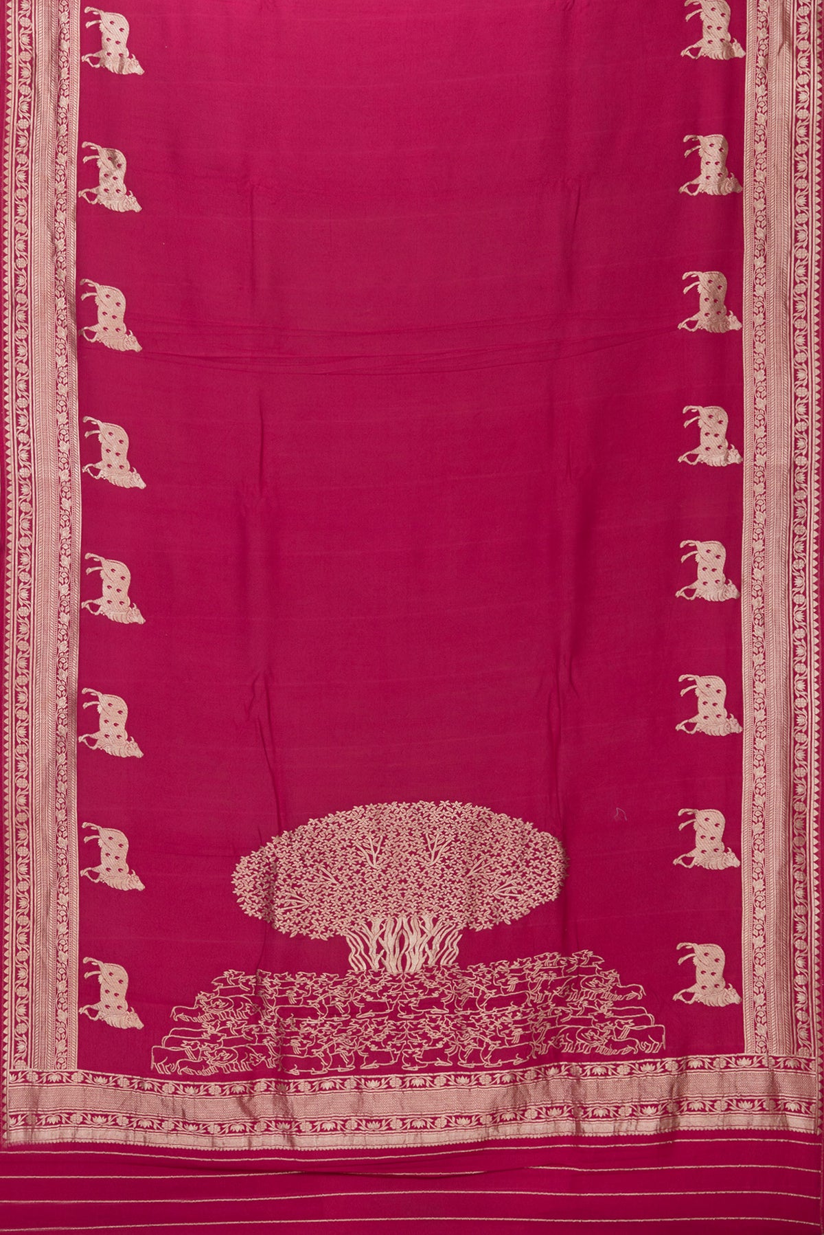 Flat view of Magenta Tussar Silk Saree with Zari Butta on the body and Fancy Border. 