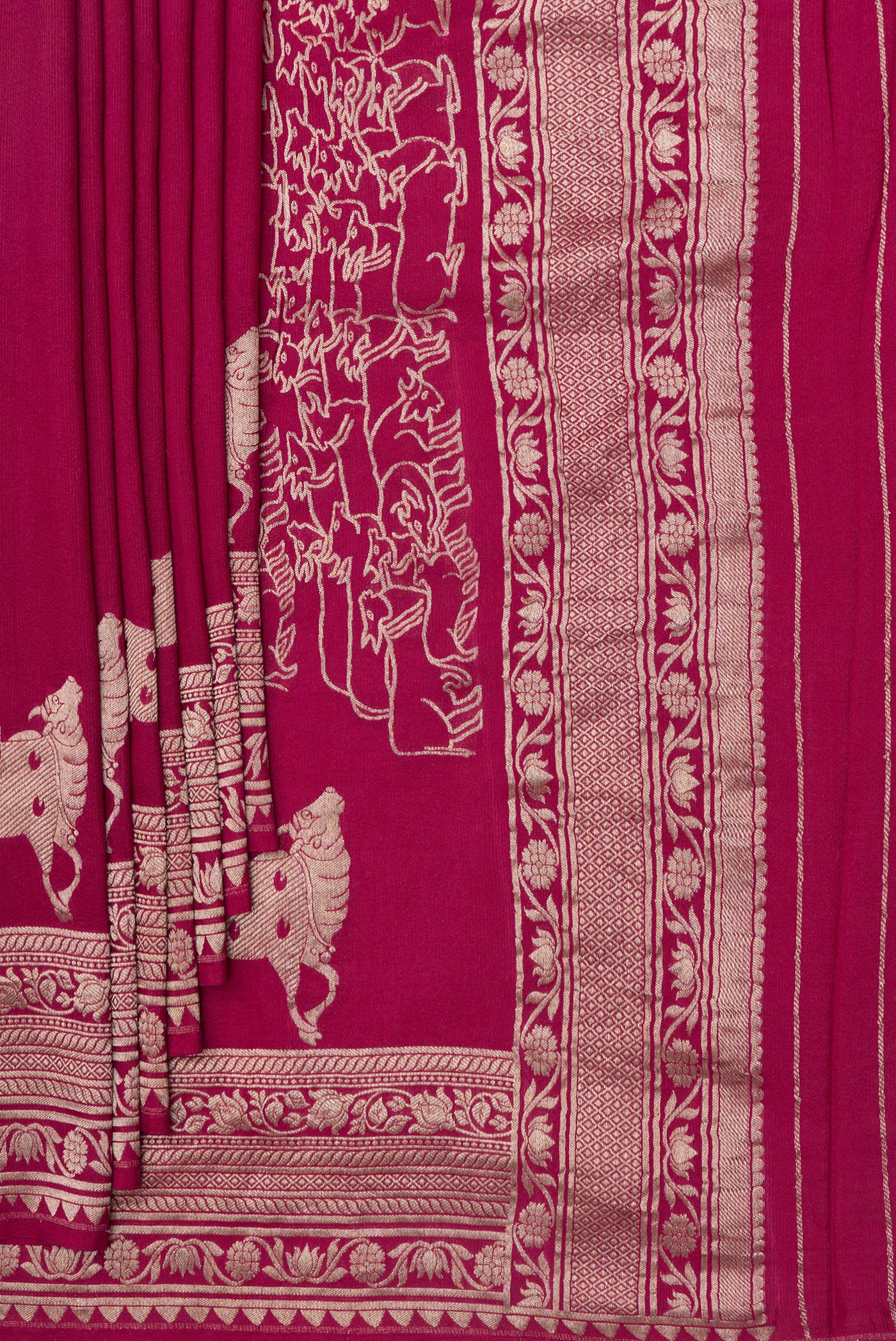Pleats and pallu of Magenta Tussar Silk Saree with Zari Butta on the body and Fancy Border. 