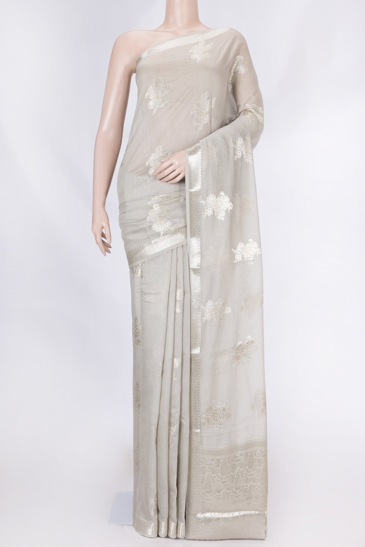 Grey Dual Tone Tussar Silk Saree with Zari Brocade on the body and Zari Border displayed on a mannequin