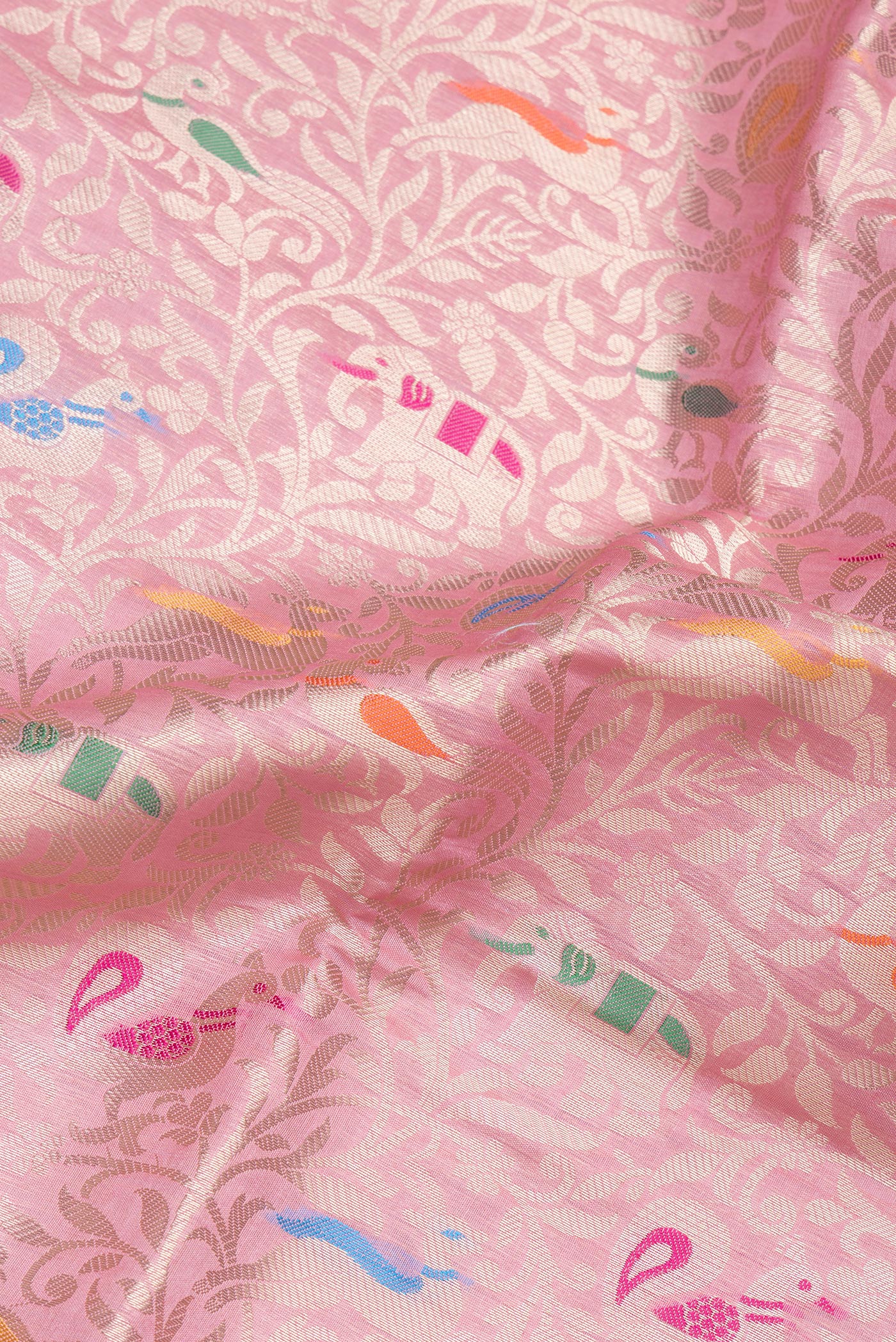 Close up of Pink Dual Tone Tussar Silk Saree with Zari Brocade on the body and Zari Border.  displaying folds