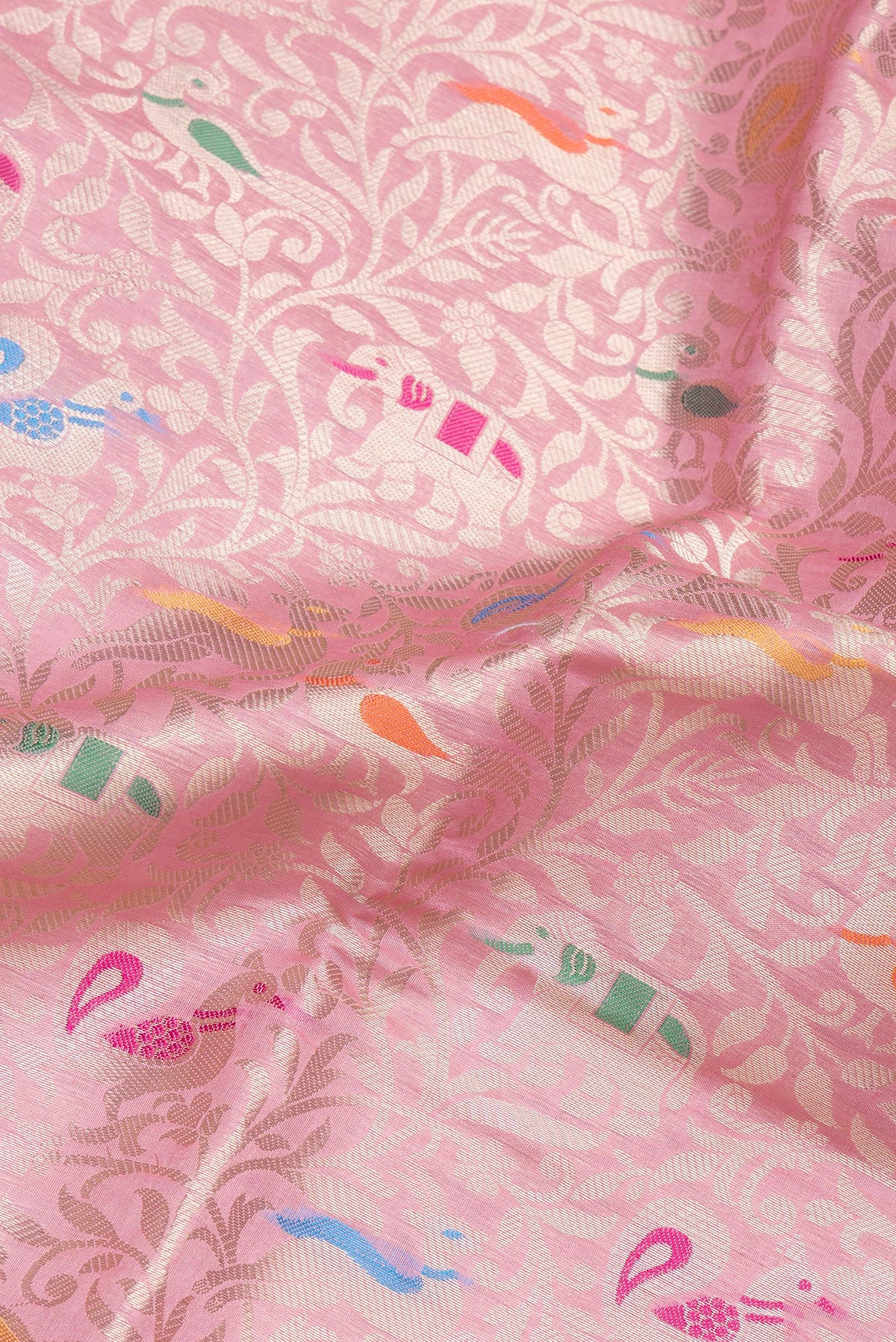 Close up of Pink Dual Tone Tussar Silk Saree with Zari Brocade on the body and Zari Border.  displaying folds