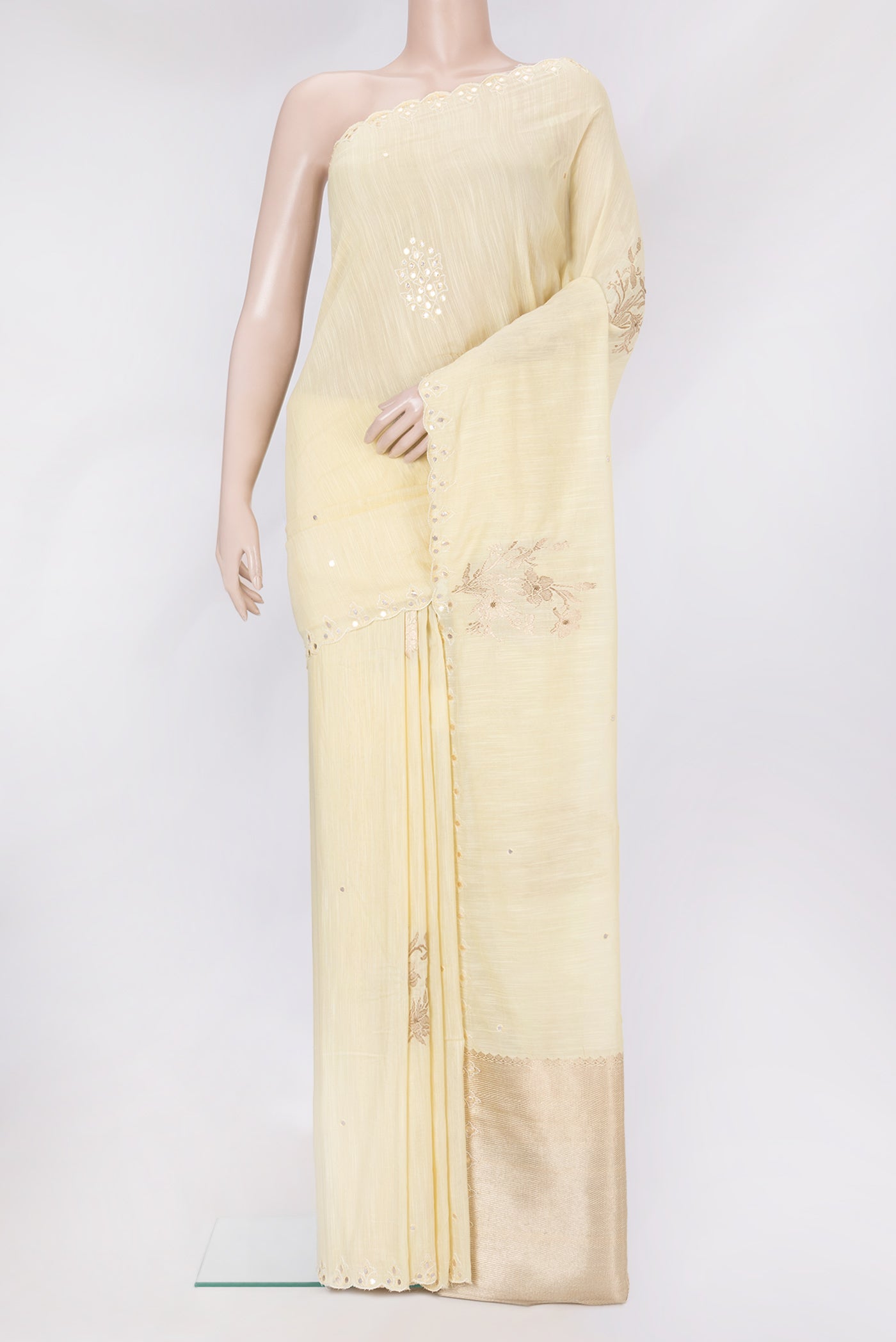 Sandal Tussar Silk Saree with Embroidery on the body and Embroidery Border.  displayed on a mannequin