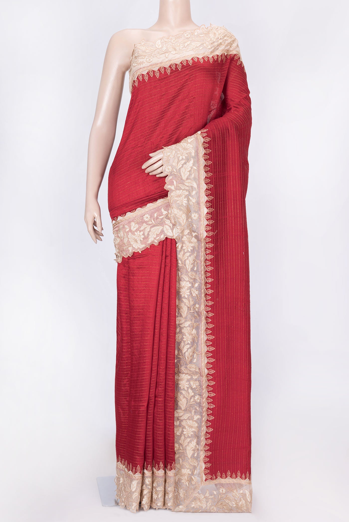 Red Dual Tone Tussar Silk Saree with Stripes on the body and Embroidery Border displayed on a mannequin