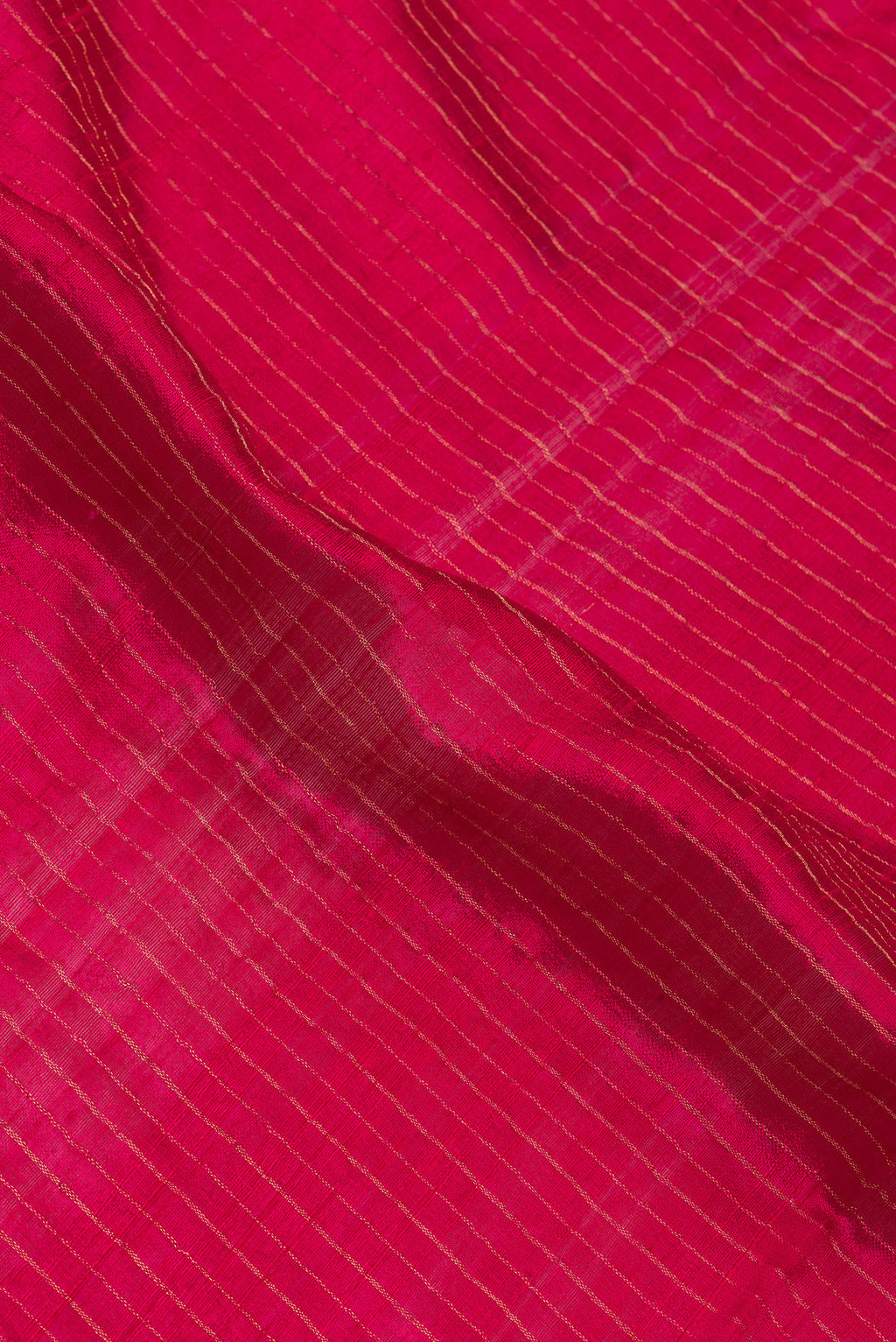 Close up of Dark Pink Tussar Silk Saree with Stripes on the body and Fancy Border.  displaying folds