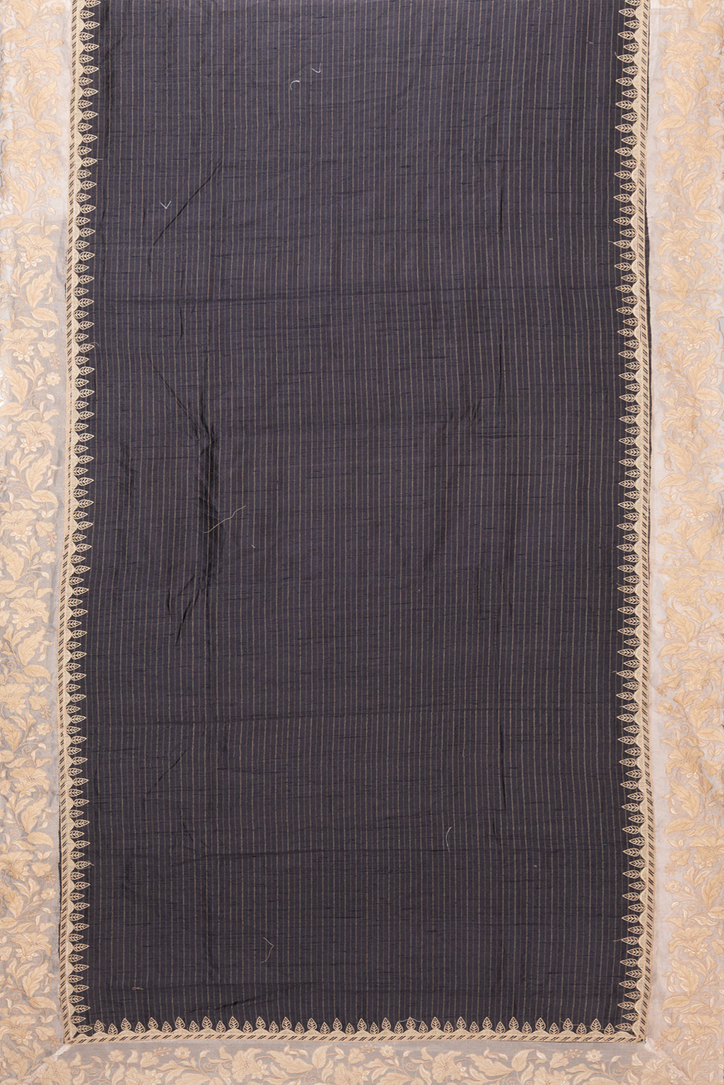 Flat view of Black Tussar Silk Saree with Stripes on the body and Embroidery Border. 