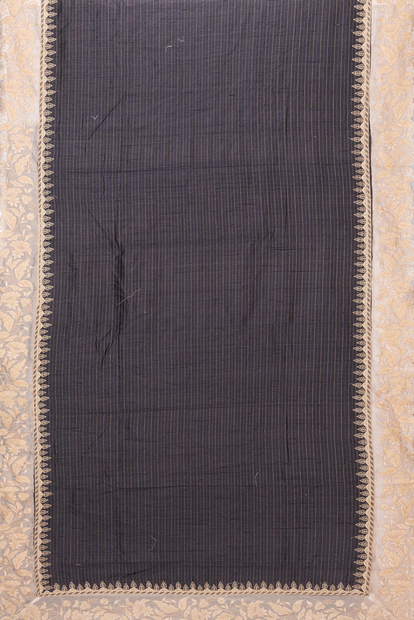 Flat view of Black Tussar Silk Saree with Stripes on the body and Embroidery Border. 