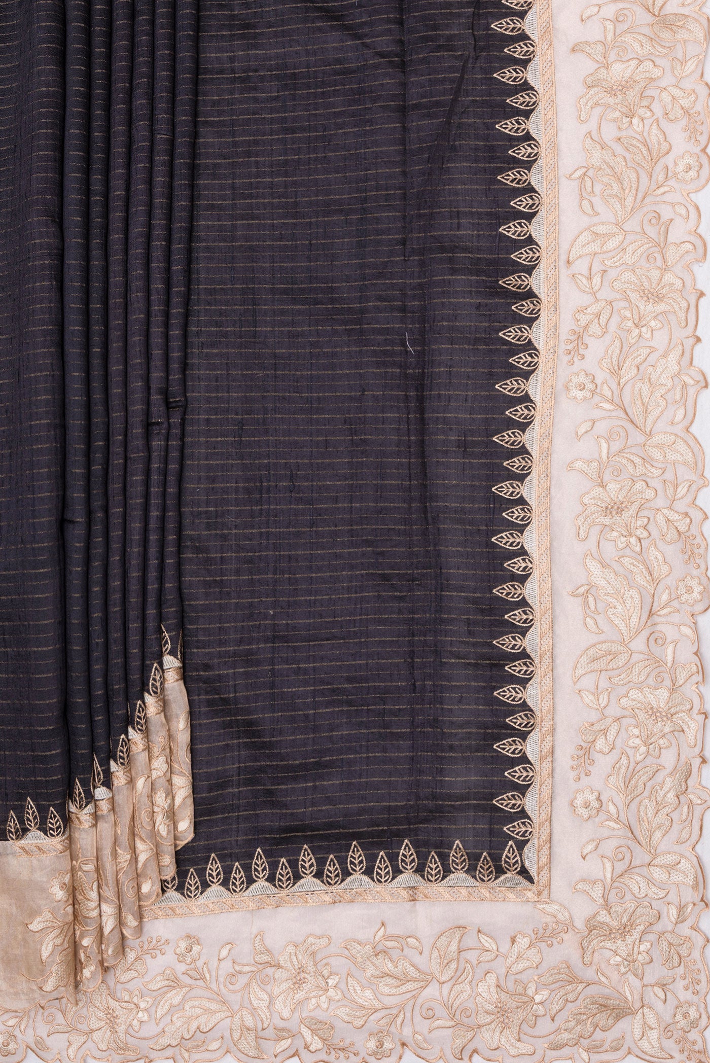 Pleats and pallu of Black Tussar Silk Saree with Stripes on the body and Embroidery Border. 
