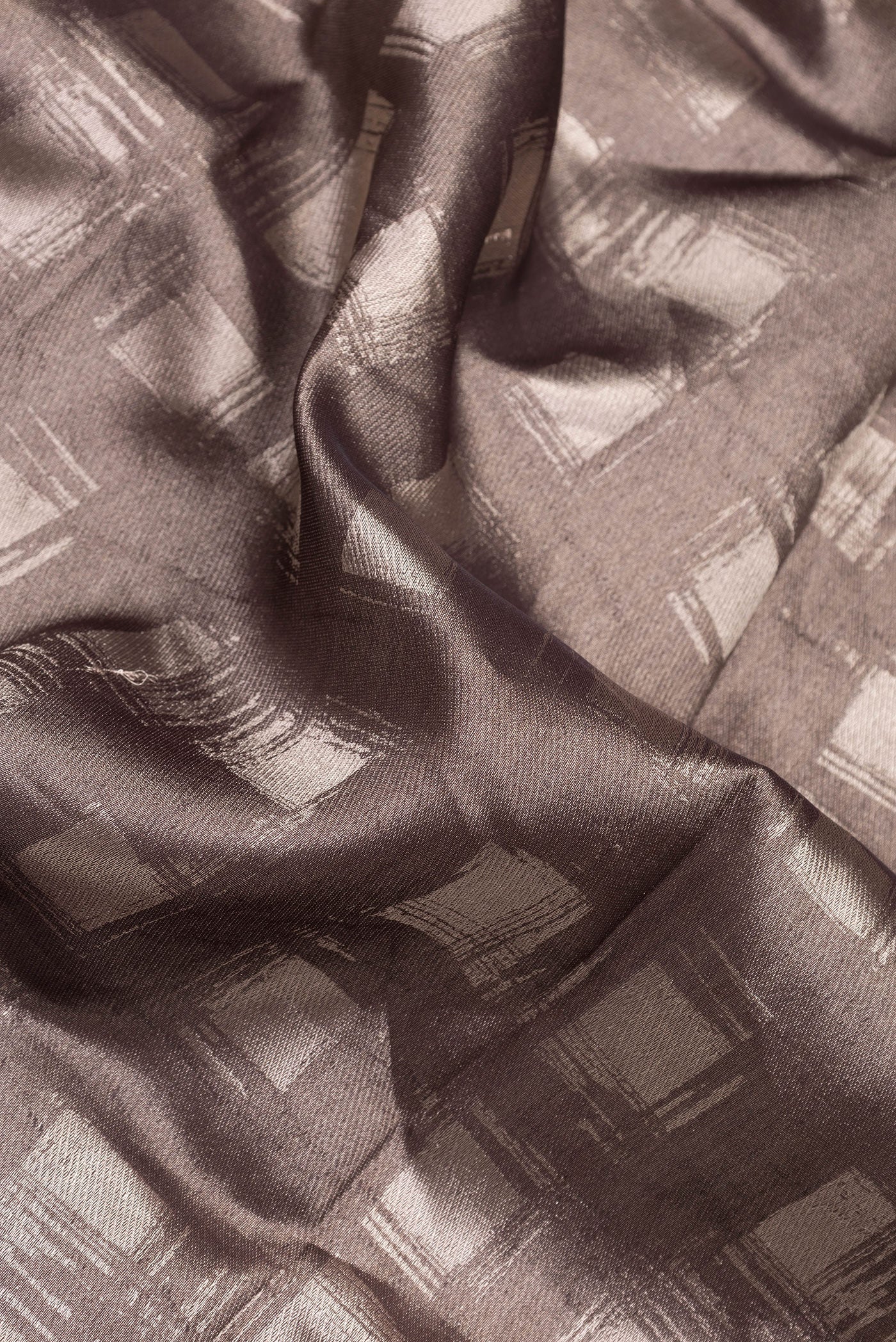 Close up of Brown Dual Tone Banarasi Silk Saree with Zari Brocade on the body and Zari Border.  displaying folds