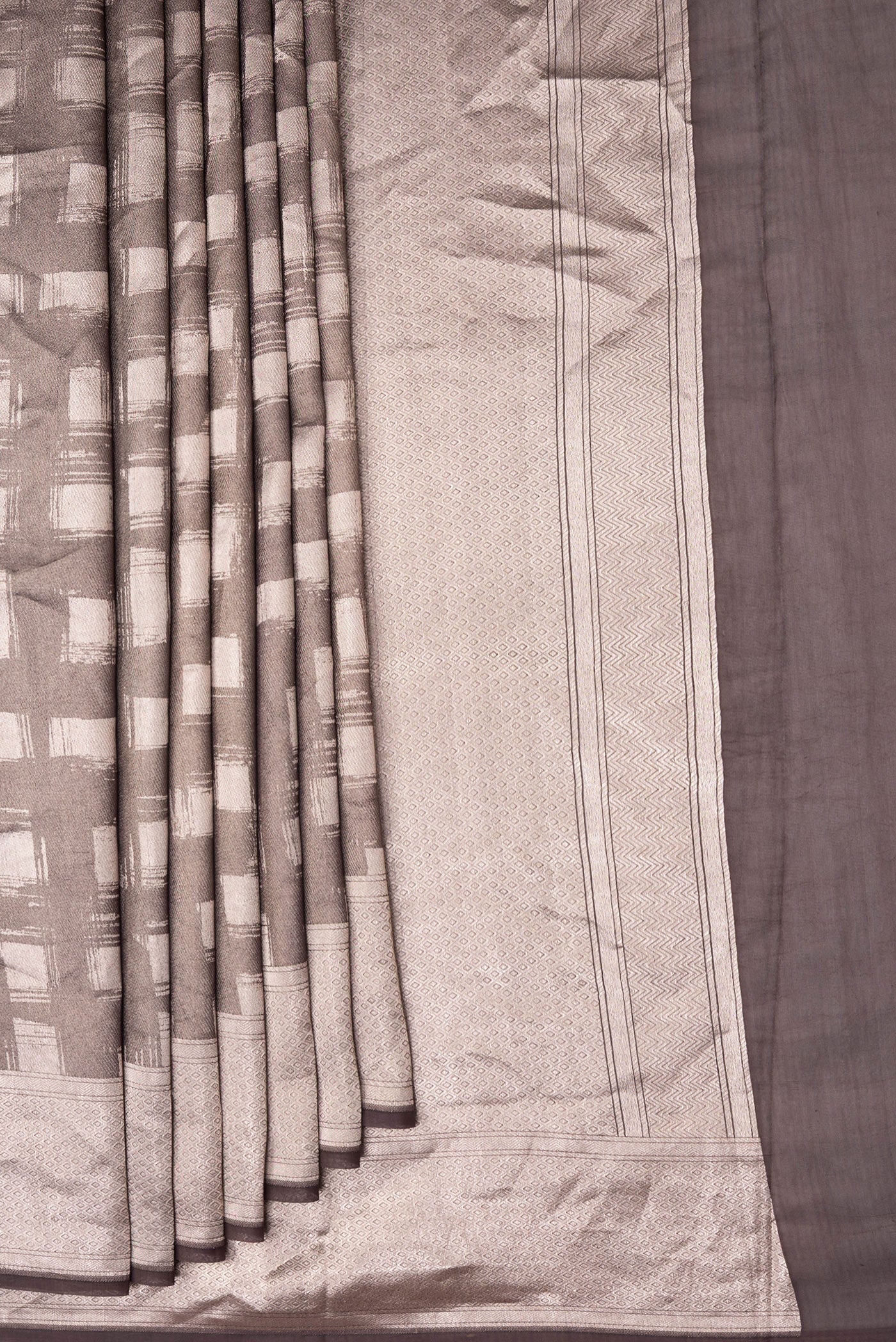 Pleats and pallu of Brown Dual Tone Banarasi Silk Saree with Zari Brocade on the body and Zari Border. 