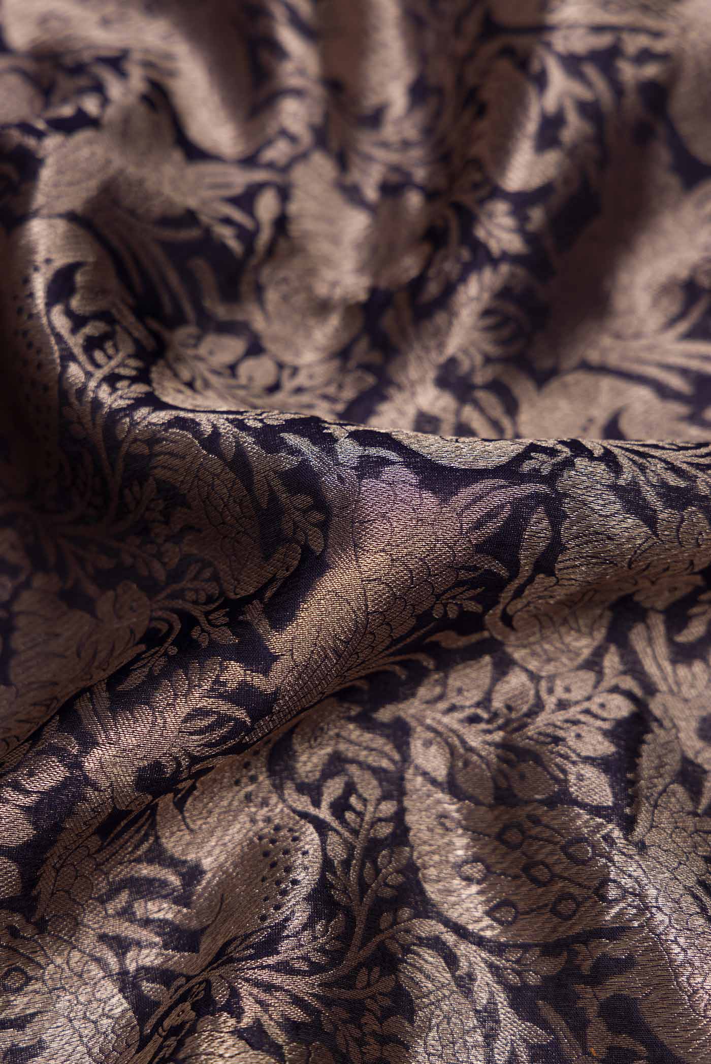 Close up of Navy Blue Dual Tone Banarasi Silk Saree with Zari Brocade on the body and Zari Border displaying folds