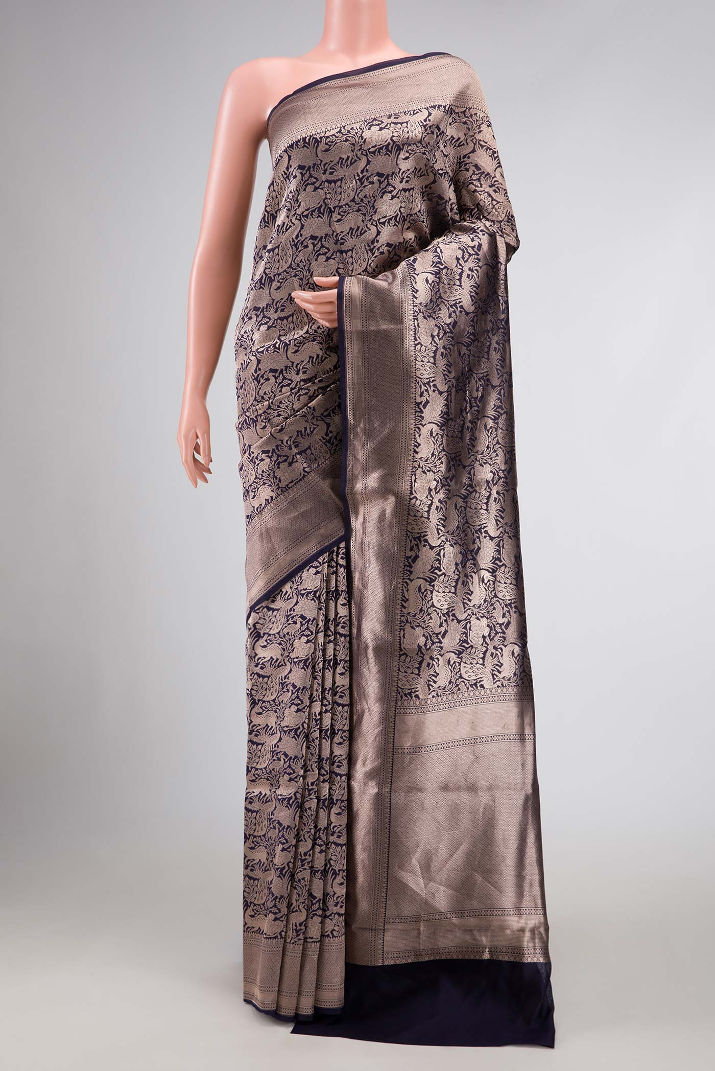 Navy Blue Dual Tone Banarasi Silk Saree with Zari Brocade on the body and Zari Border displayed on a mannequin