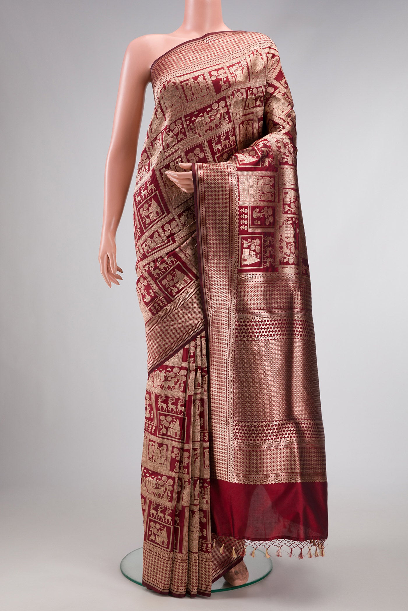 Maroon Dual Tone Banarasi Silk Saree with Zari Brocade on the body and Zari Border.  displayed on a mannequin