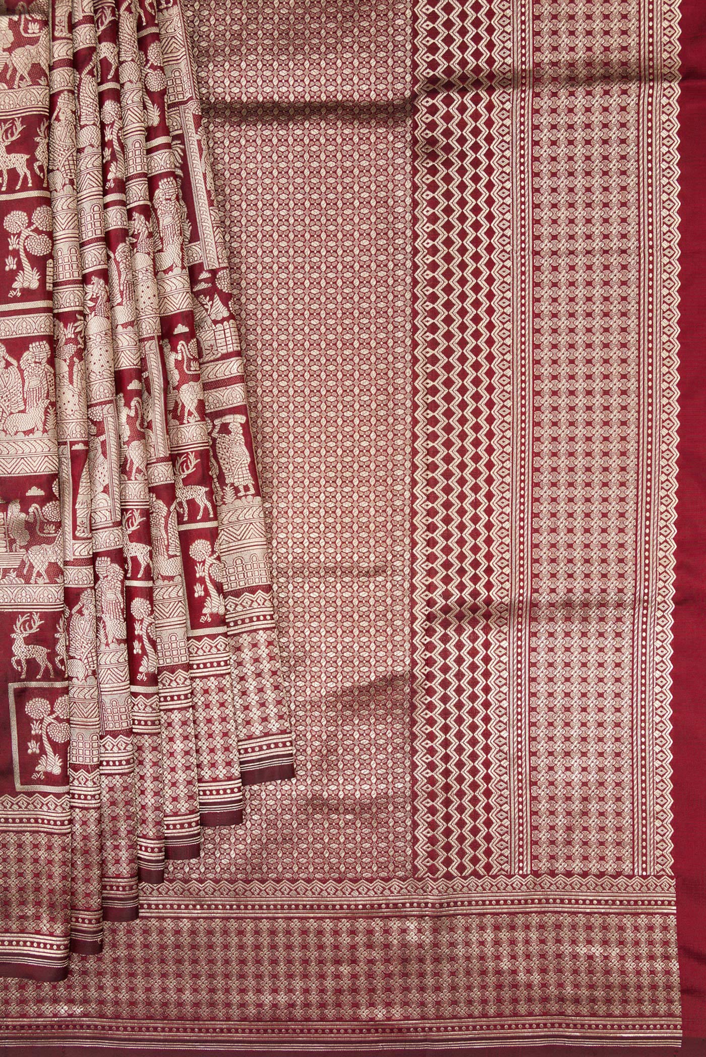 Pleats and pallu of Maroon Dual Tone Banarasi Silk Saree with Zari Brocade on the body and Zari Border. 