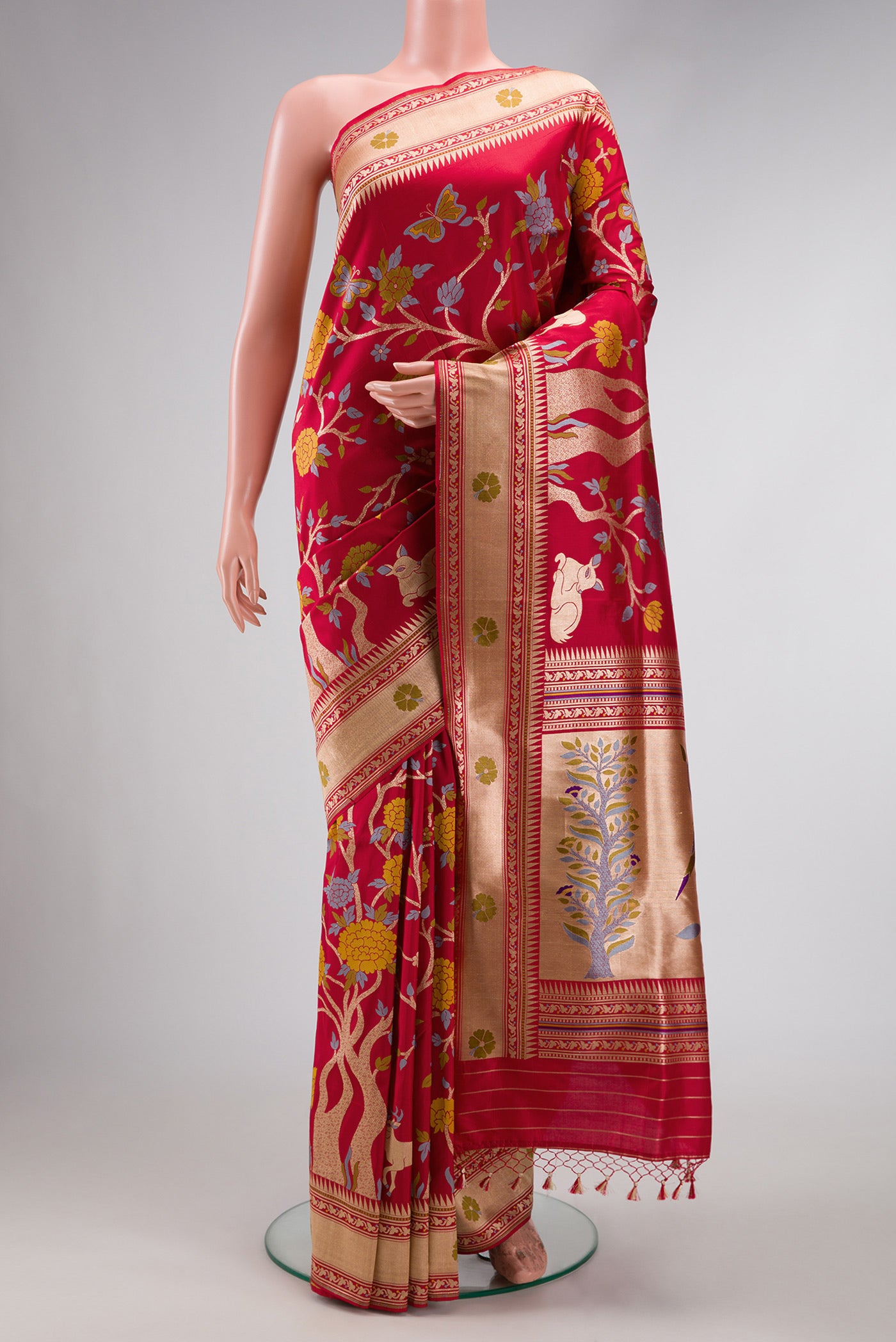 Maroon Dual Tone Banarasi Silk Saree with Zari Brocade on the body and Fancy Border.  displayed on a mannequin