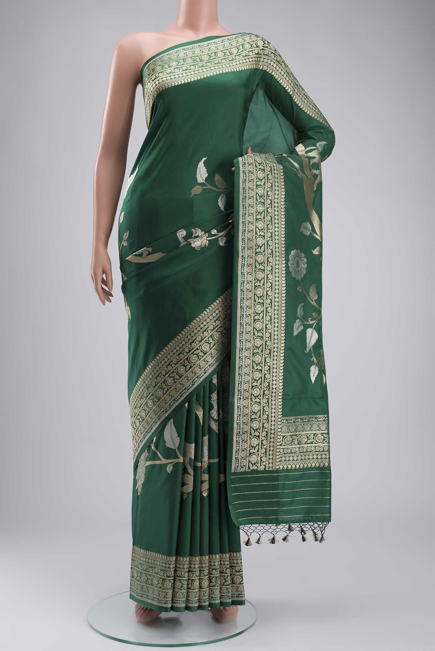 Green Banarasi Silk Saree with Zari Butta on the body and Zari Border displayed on a mannequin