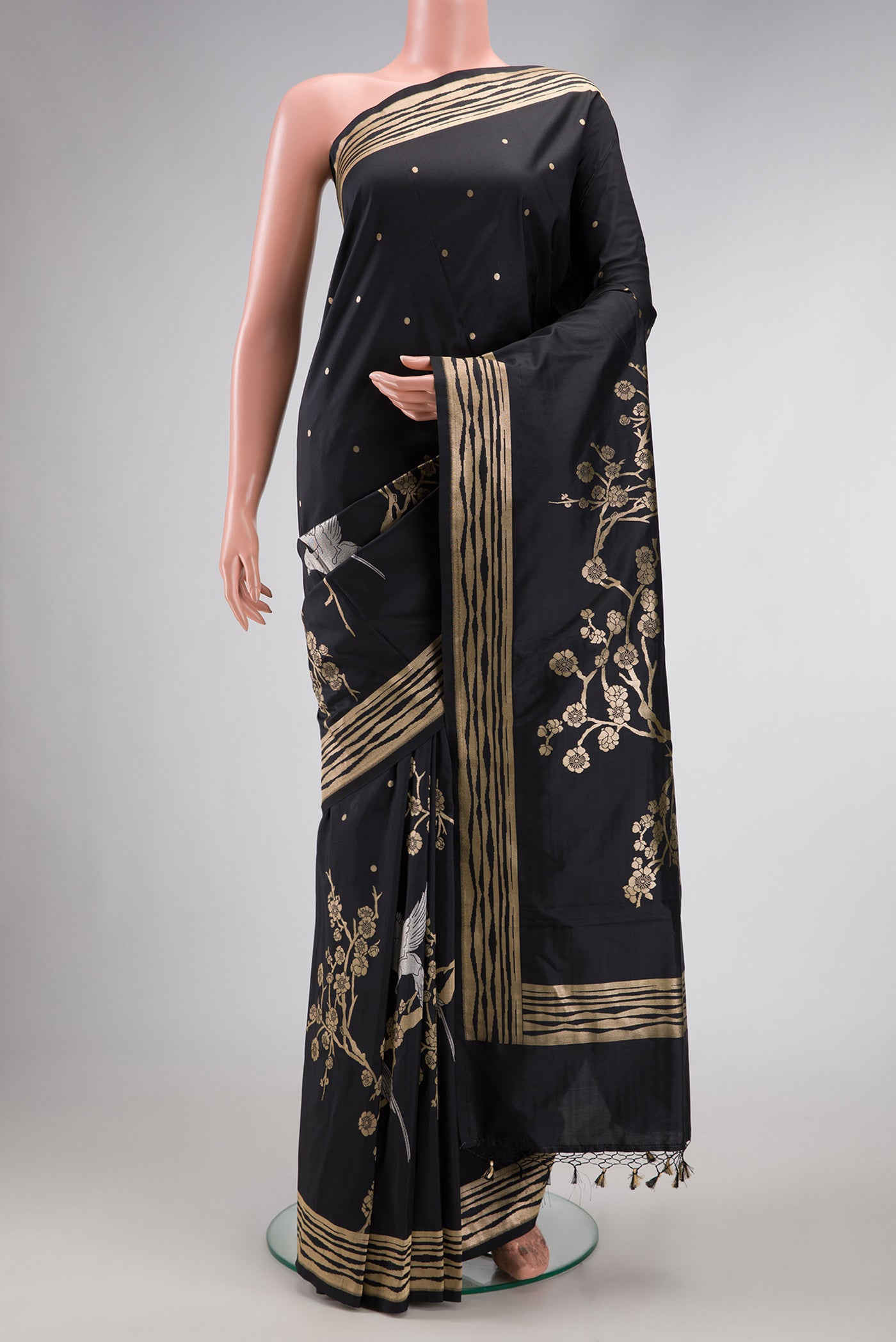 Black Dual Tone Banarasi Silk Saree with Zari Brocade on the body and Fancy Border.  displayed on a mannequin