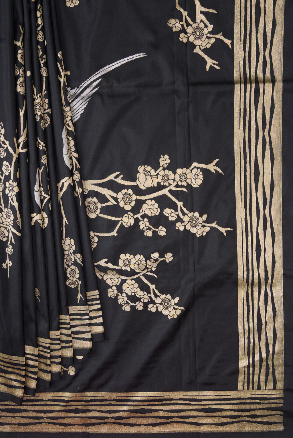 Pleats and pallu of Black Dual Tone Banarasi Silk Saree with Zari Brocade on the body and Fancy Border. 