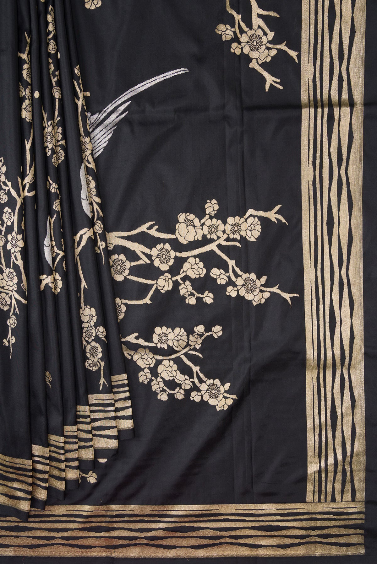 Pleats and pallu of Black Dual Tone Banarasi Silk Saree with Zari Brocade on the body and Fancy Border. 