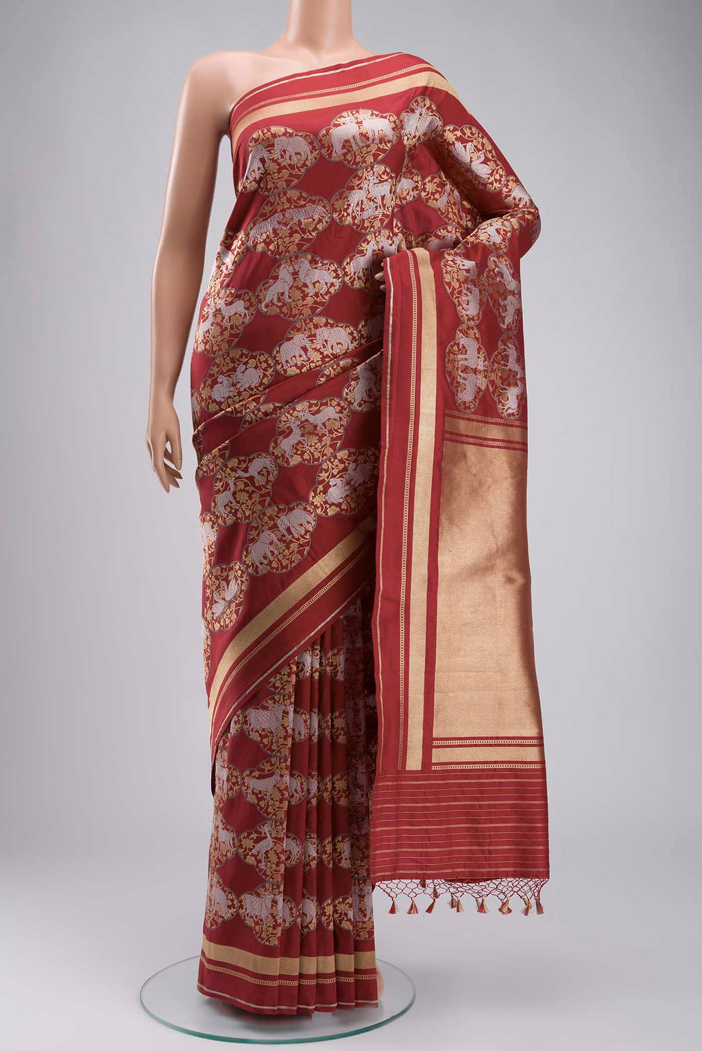 Maroon Banarasi Silk Saree with Zari Butta on the body and Zari Border displayed on a mannequin