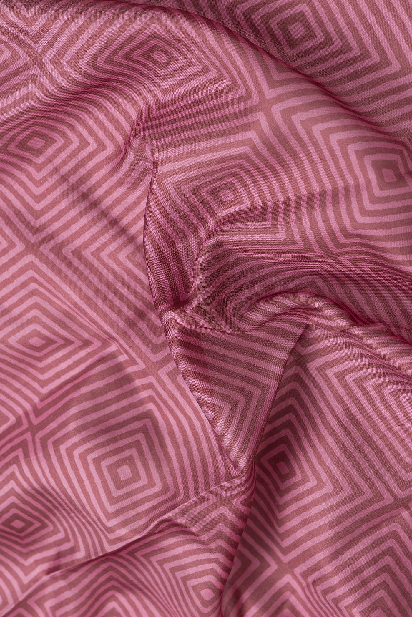 Close up of Brown Dual Tone Printed Silk Saree with Printed design on the body and Thread Border.  displaying folds