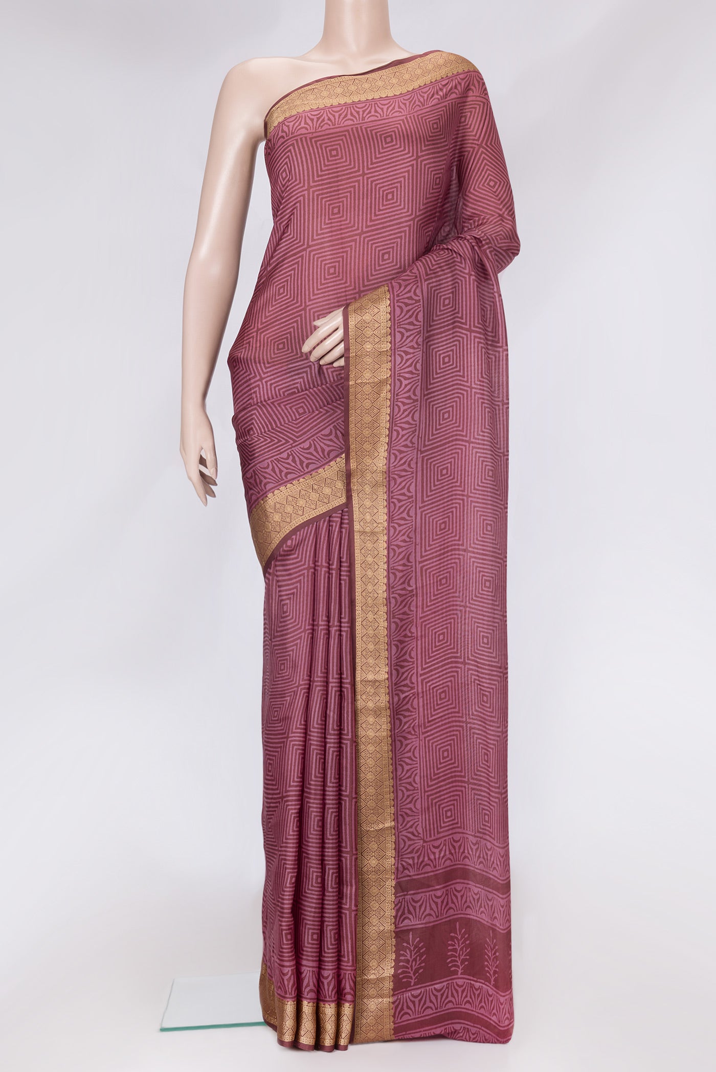 Brown Dual Tone Printed Silk Saree with Printed design on the body and Thread Border.  displayed on a mannequin