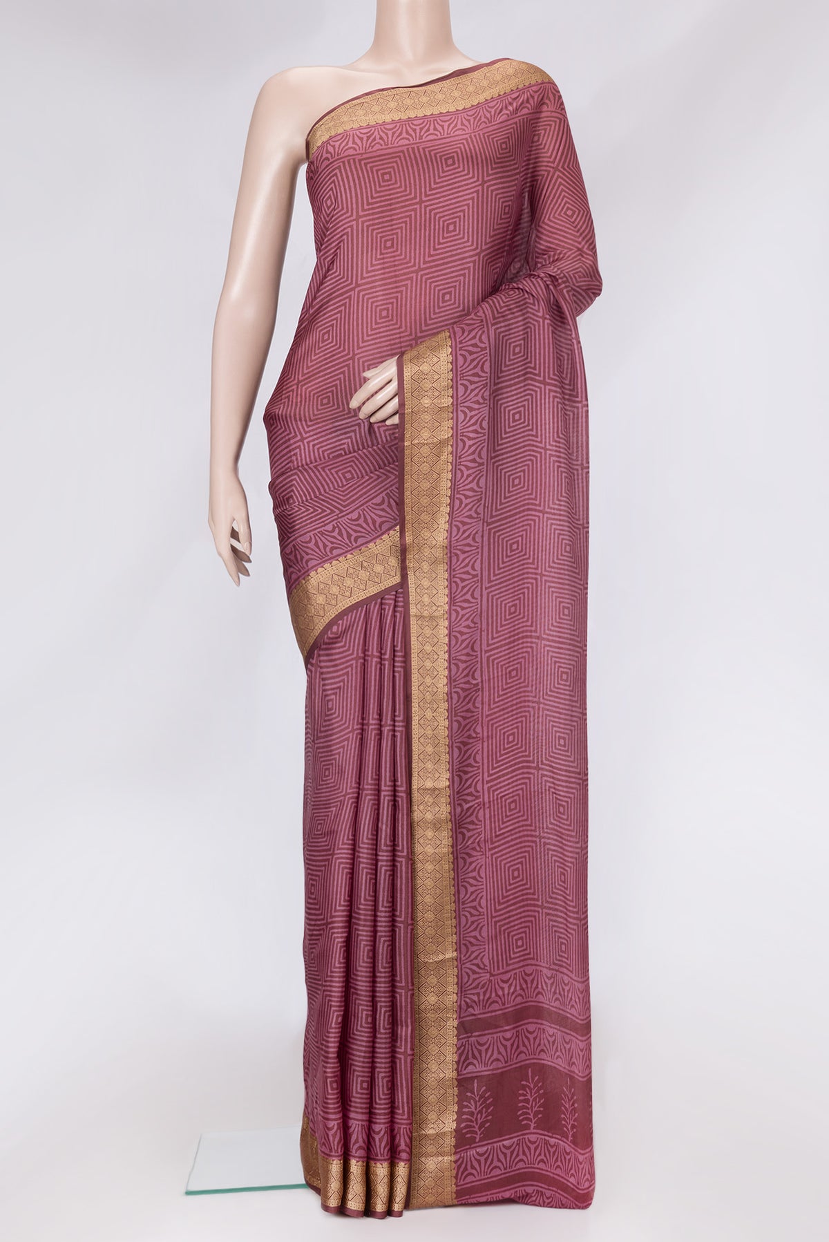 Brown Dual Tone Printed Silk Saree with Printed design on the body and Thread Border.  displayed on a mannequin