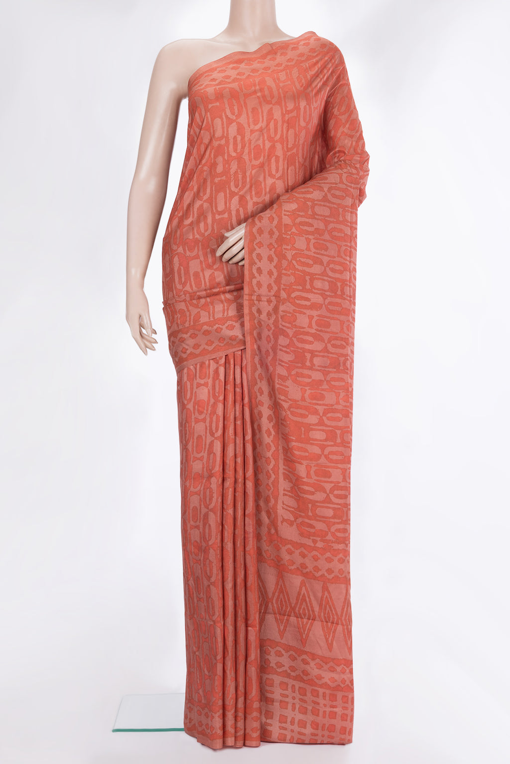 Pure Silk Peach Dual Tone Tussar Saree with Printed design on the body and Printed Border.  displayed on a mannequin
