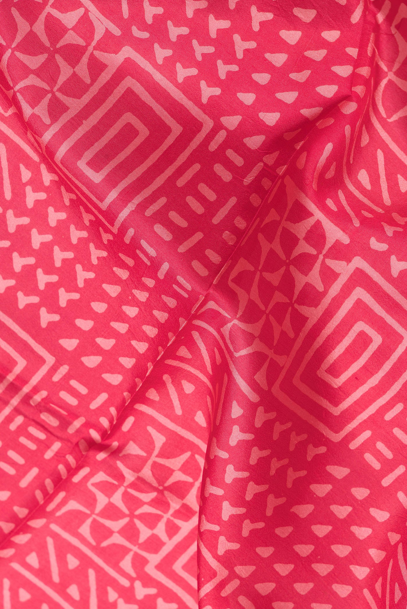 Close up of Pink Dual Tone Printed Silk Saree with Printed design on the body and Printed Border.  displaying folds