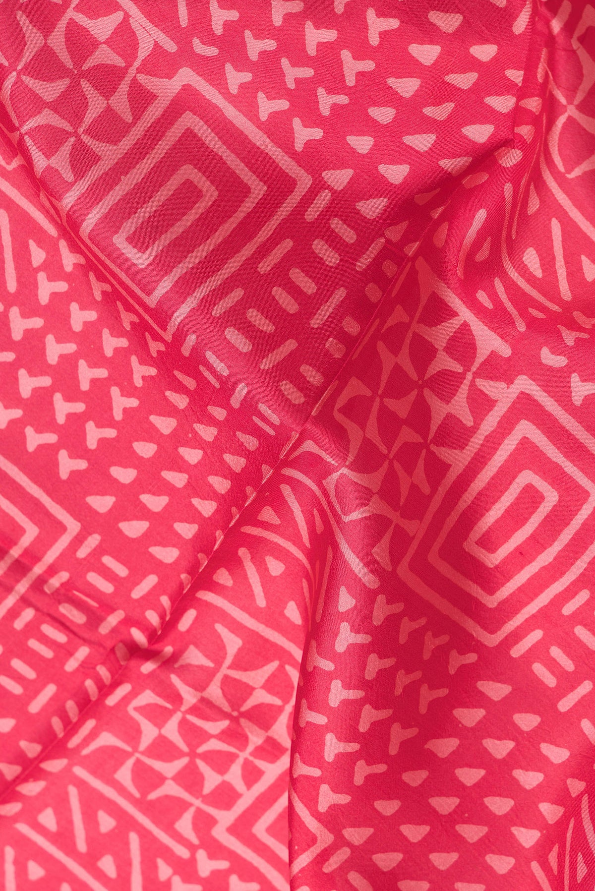 Close up of Pink Dual Tone Printed Silk Saree with Printed design on the body and Printed Border.  displaying folds