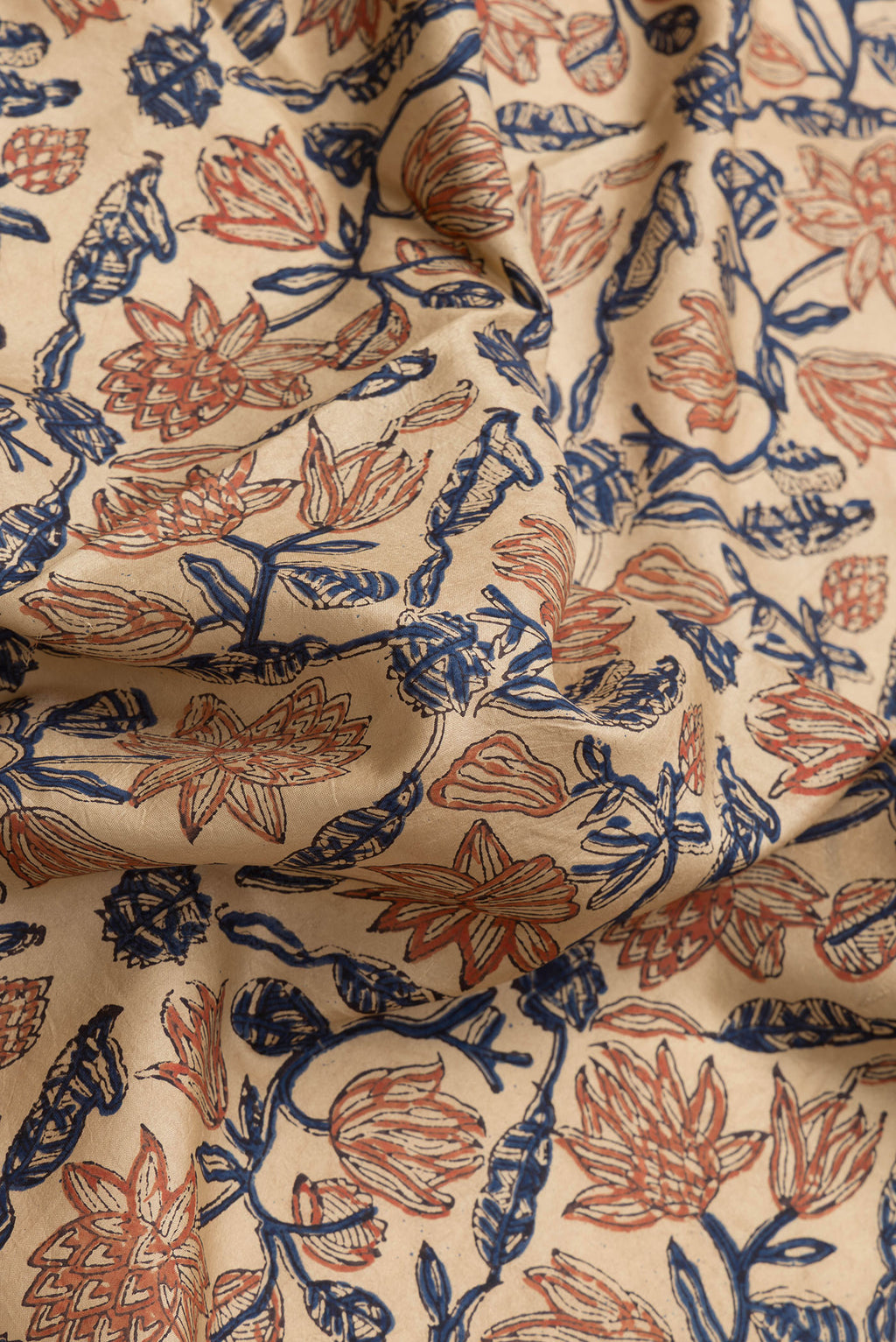 Close up of Beige Dual Tone Printed Silk Saree with Printed design on the body and Printed Border.  displaying folds