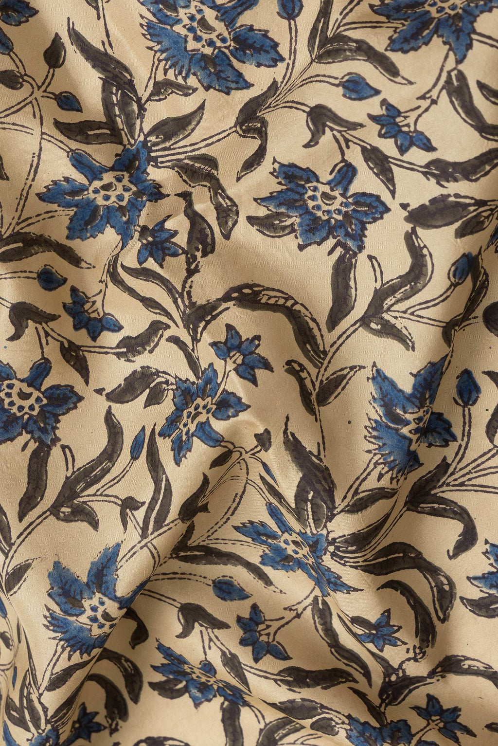 Close up of Beige Dual Tone Printed Silk Saree with Printed design on the body and Printed Border.  displaying folds