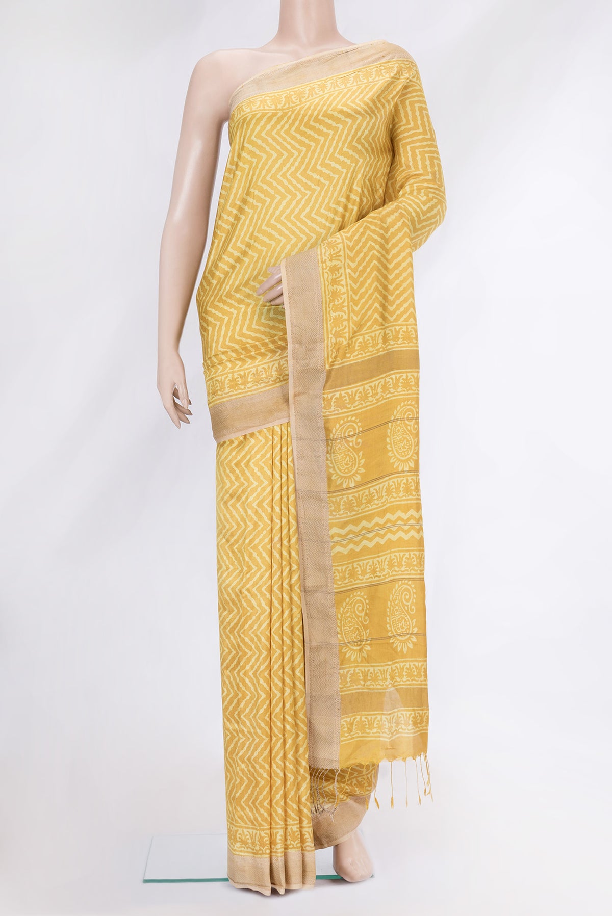 Yellow Dual Tone Tussar Silk Saree with Printed design on the body and Zari Border.  displayed on a mannequin