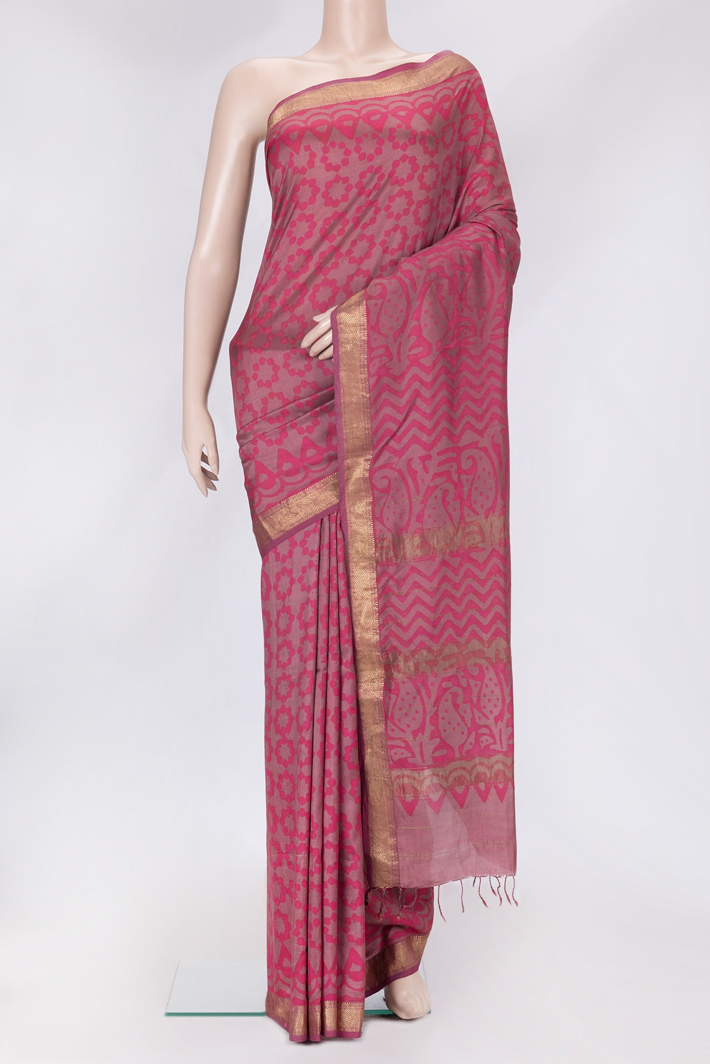 Pink Dual Tone Printed Silk Saree with Printed design on the body and Zari Border.  displayed on a mannequin