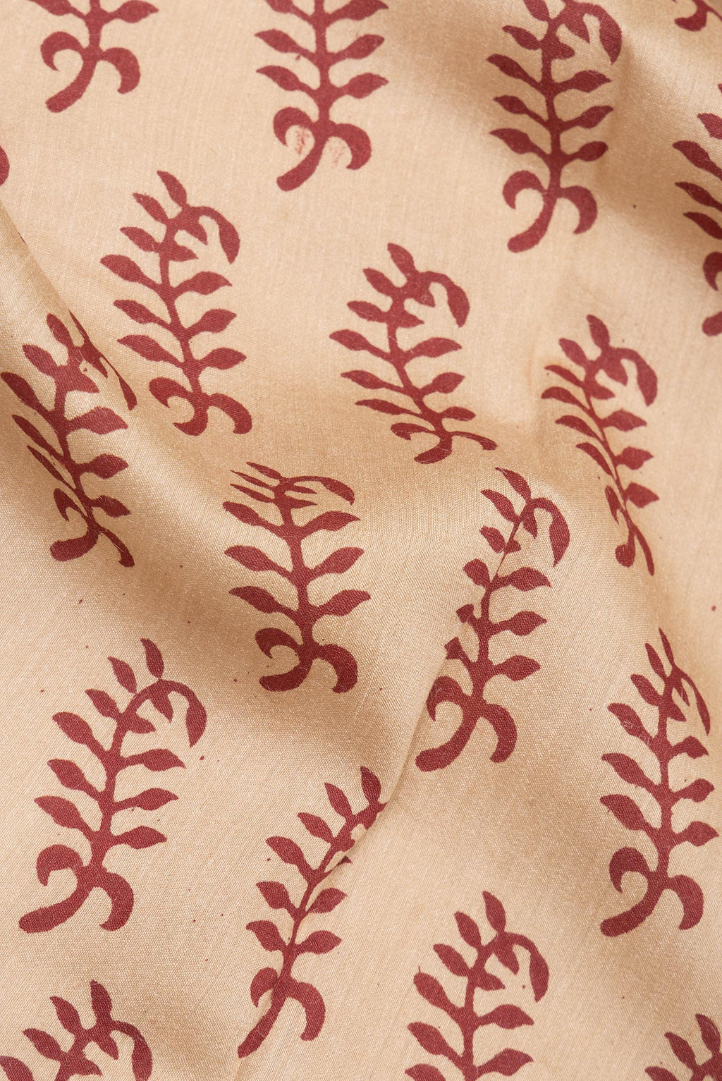 Close up of Pure Silk Beige Dual Tone Tussar Saree with Printed design on the body and Printed Border.  displaying folds