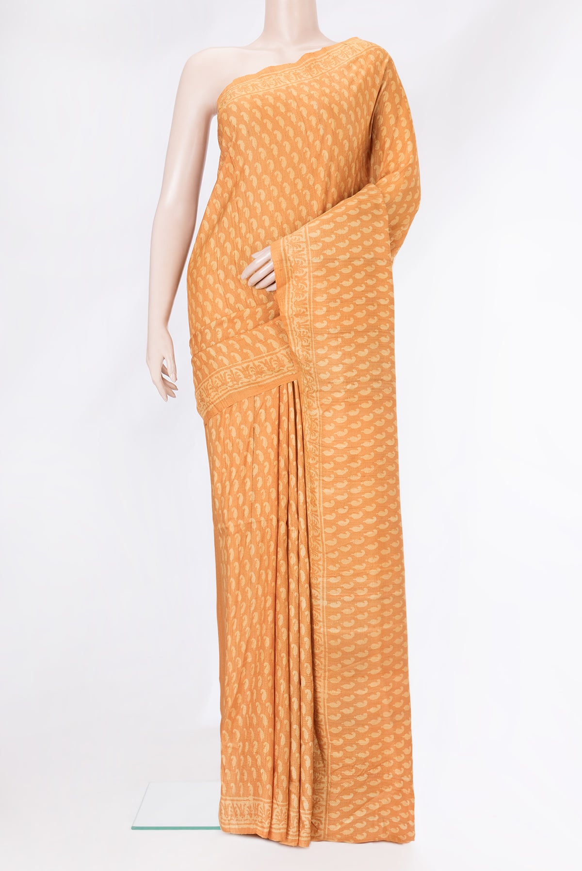 Mustard Dual Tone Tussar Silk Saree with Printed design on the body and Printed Border.  displayed on a mannequin