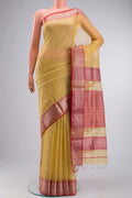 Yellow Maheshwari Silk Cotton Saree with Zari Butta on the body and Zari Border displayed on a mannequin