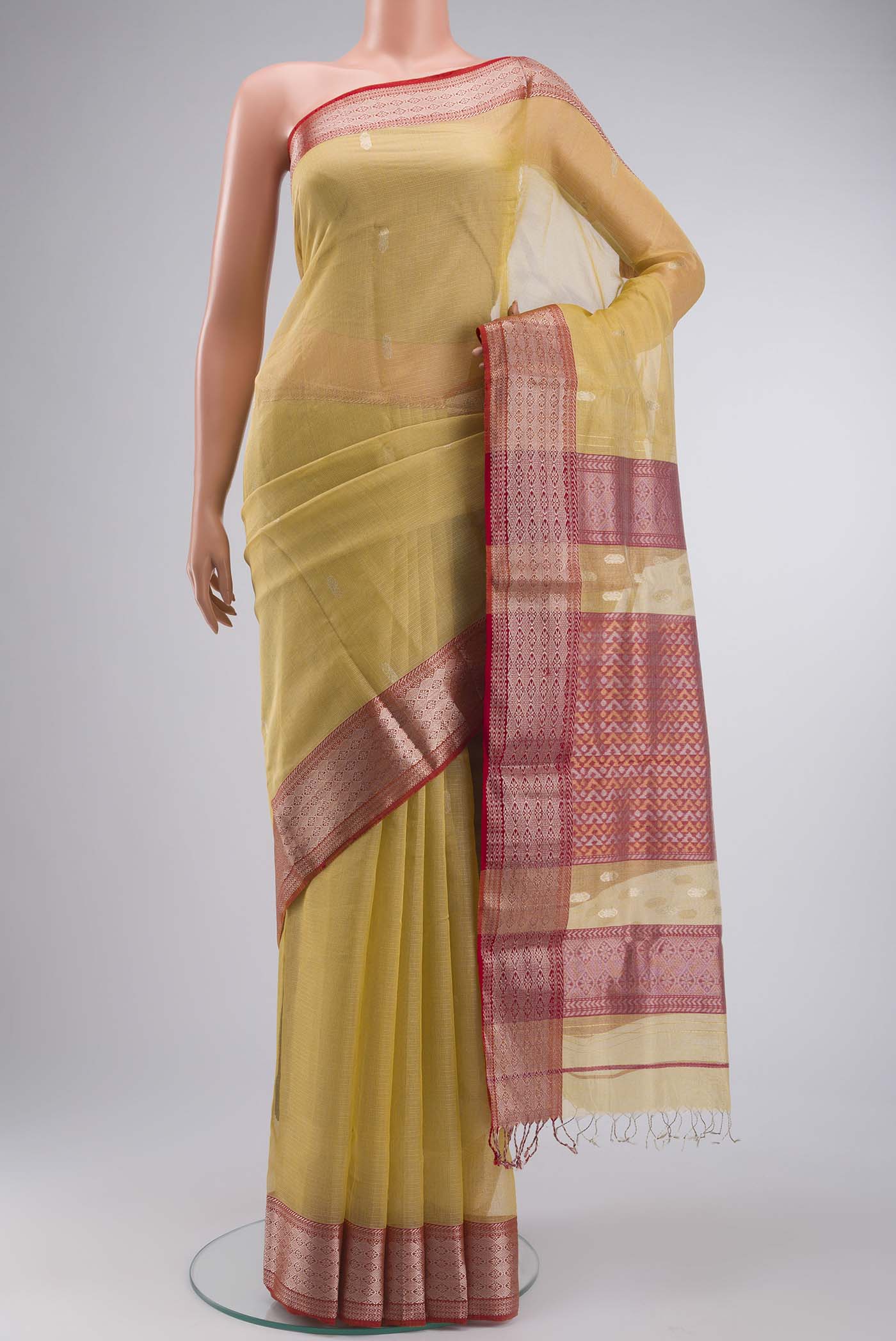 Yellow Maheshwari Silk Cotton Saree with Zari Butta on the body and Zari Border displayed on a mannequin