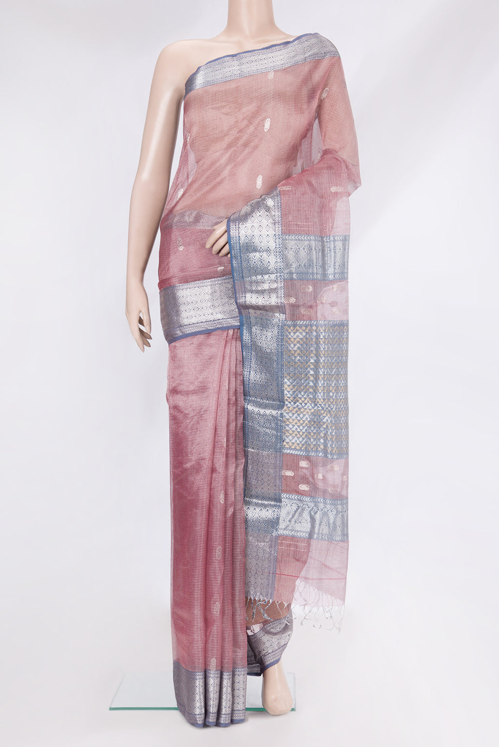 Rose Gold Maheshwari Tissue Silk Cotton Saree with Zari Butta on the body and Zari Border.  displayed on a mannequin