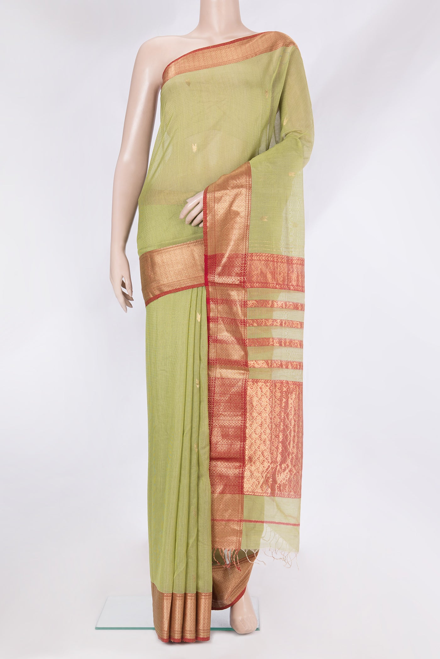 Mehandi Green Maheshwari Silk Cotton Saree with Zari Butta on the body and Zari Border.  displayed on a mannequin