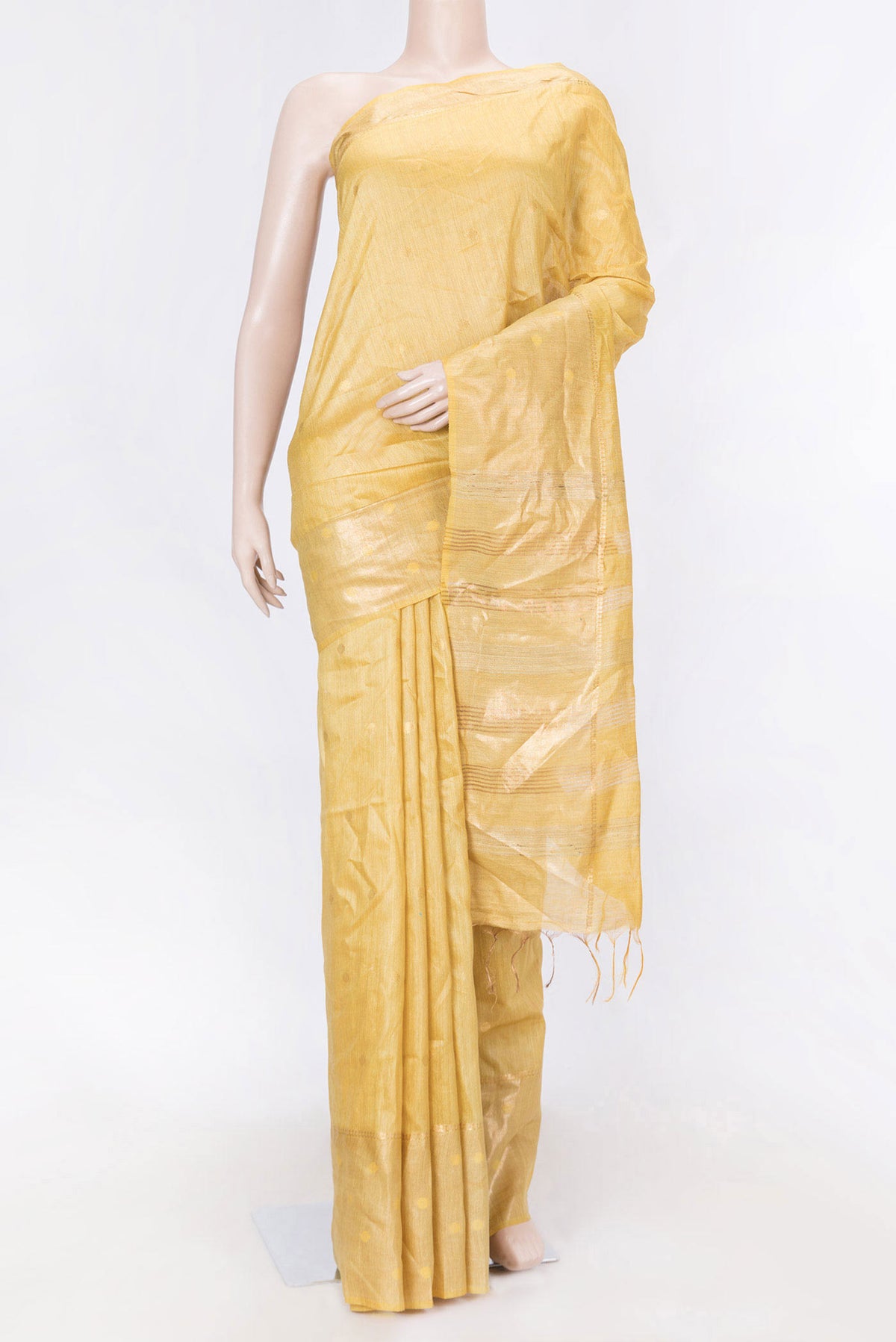 Mustard Dual Tone Tussar Saree with Zari Butta on the body and Zari Border displayed on a mannequin