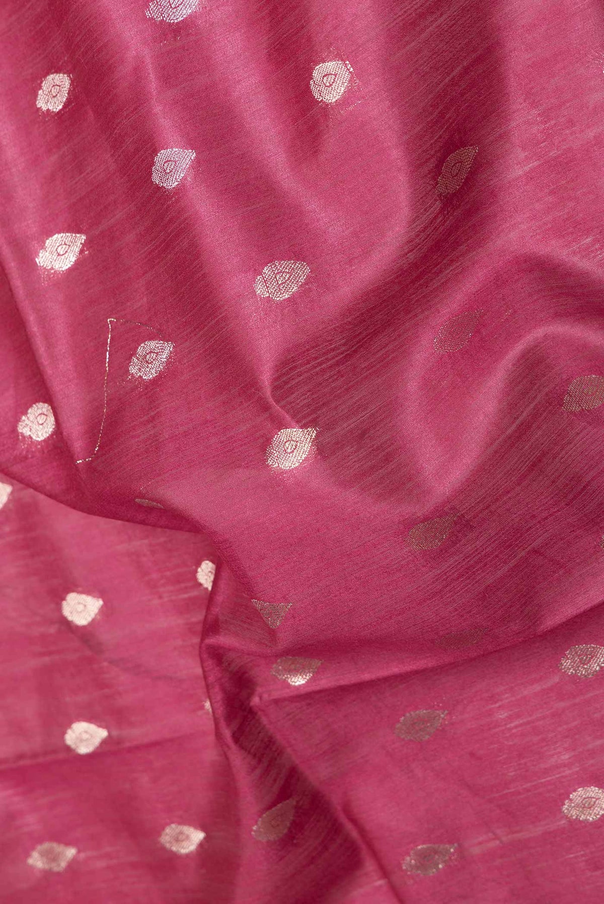 Close up of Maroon Dual Tone Tussar Saree with Zari Butta on the body and Zari Border displaying folds