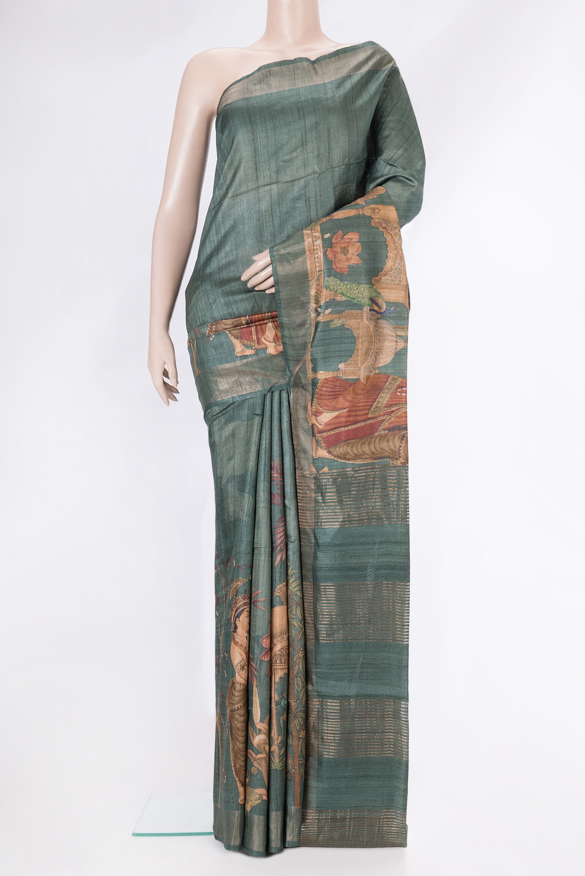 Green Dual Tone Tussar Silk Saree with Printed design on the body and Fancy Border.  displayed on a mannequin